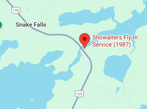 Map showing the location of Showalters Fly-In Service near Snake Falls with nearby lakes and highways.
