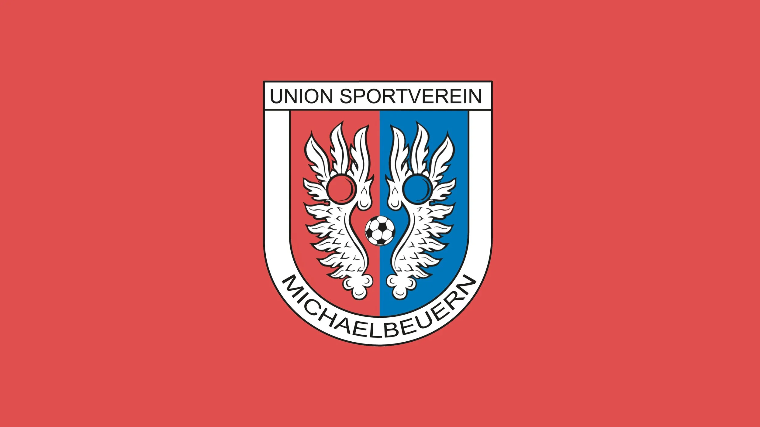 Das Logo des Fußballvereins Michaelbeuern, bestehend aus einem roten und blauen Wappen mit zwei weißen Drachen, einem Fußball in der Mitte und dem Text 'Union Sportverein Michaelbeuern'.