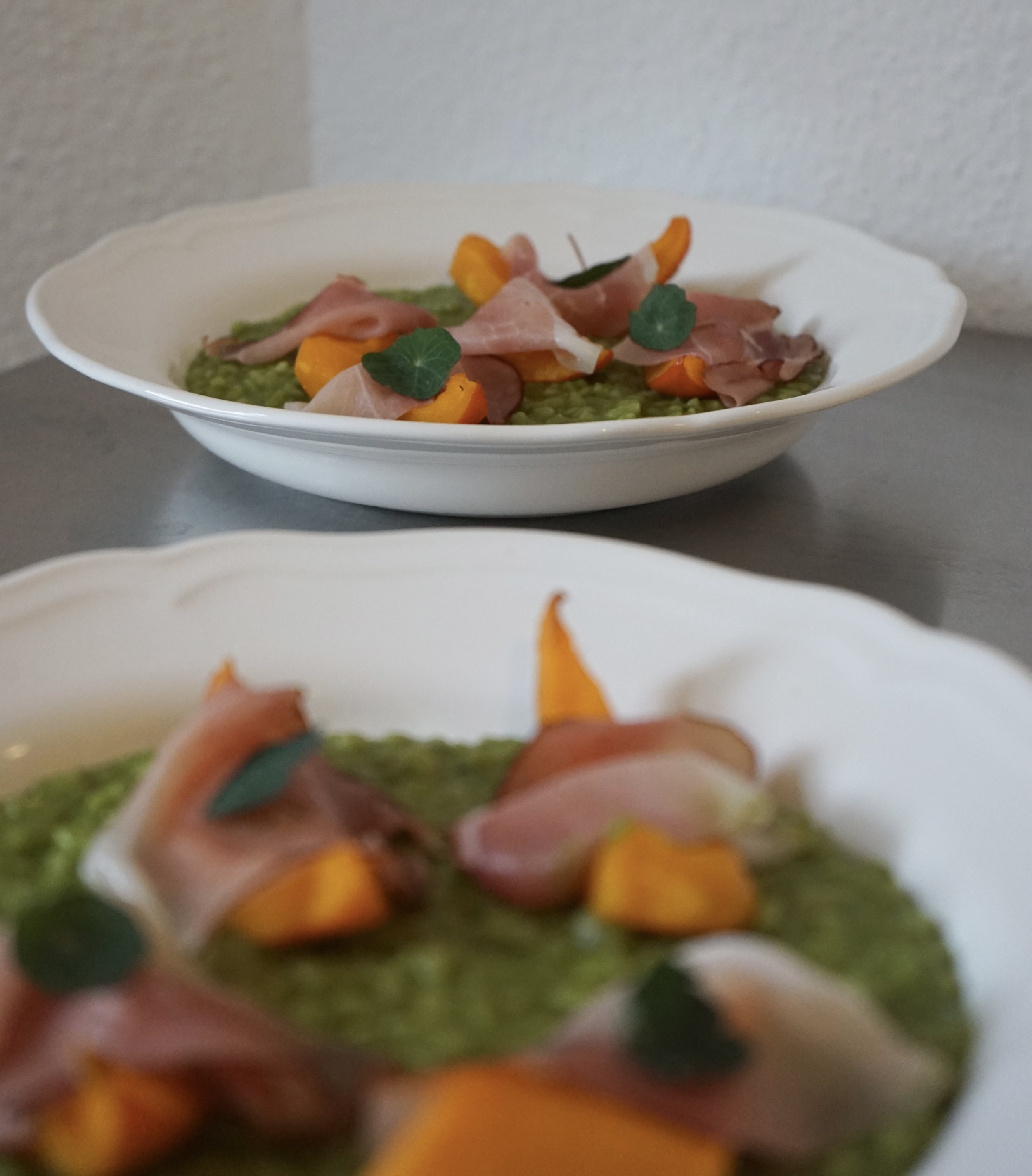 Basil risotto with roasted pumpkin and smoked prosciutto