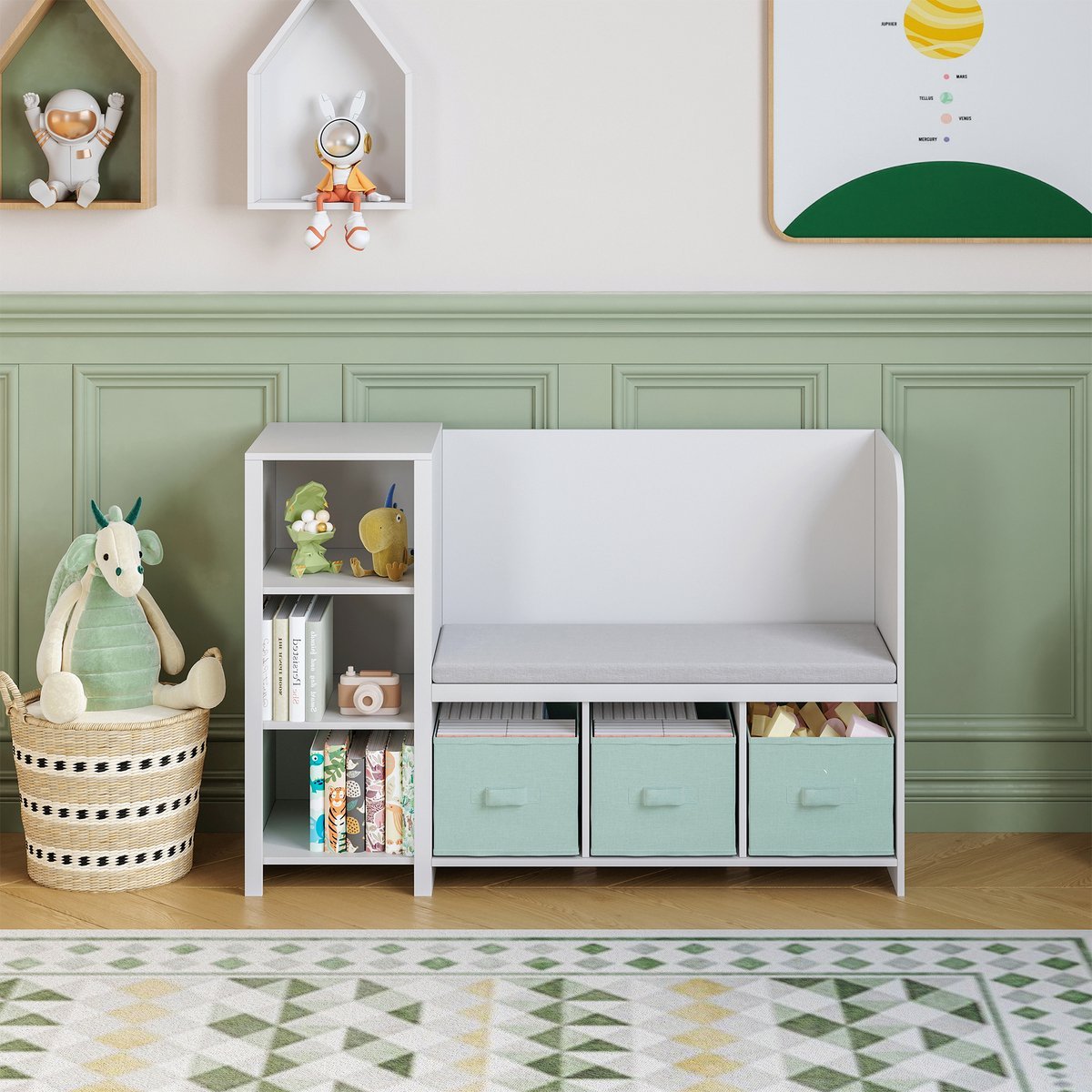 A children's room with a light green wainscoting wall, a white bench with storage bins, toys, and stuffed animals, including a plush dragon in a basket, and decorations like bunny and space-themed wall art.