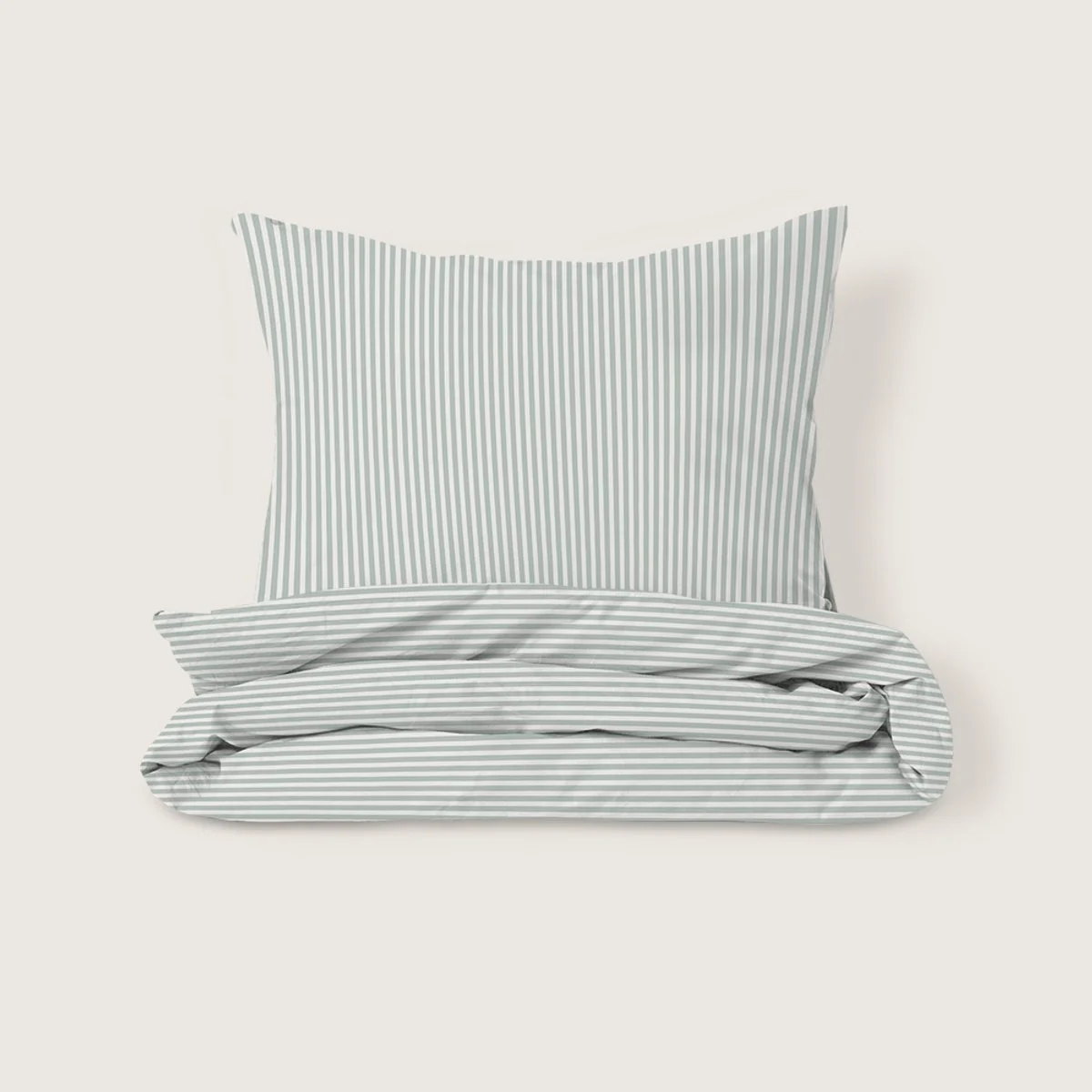 A pillow and folded bed linens with gray and white vertical stripes on a plain background.