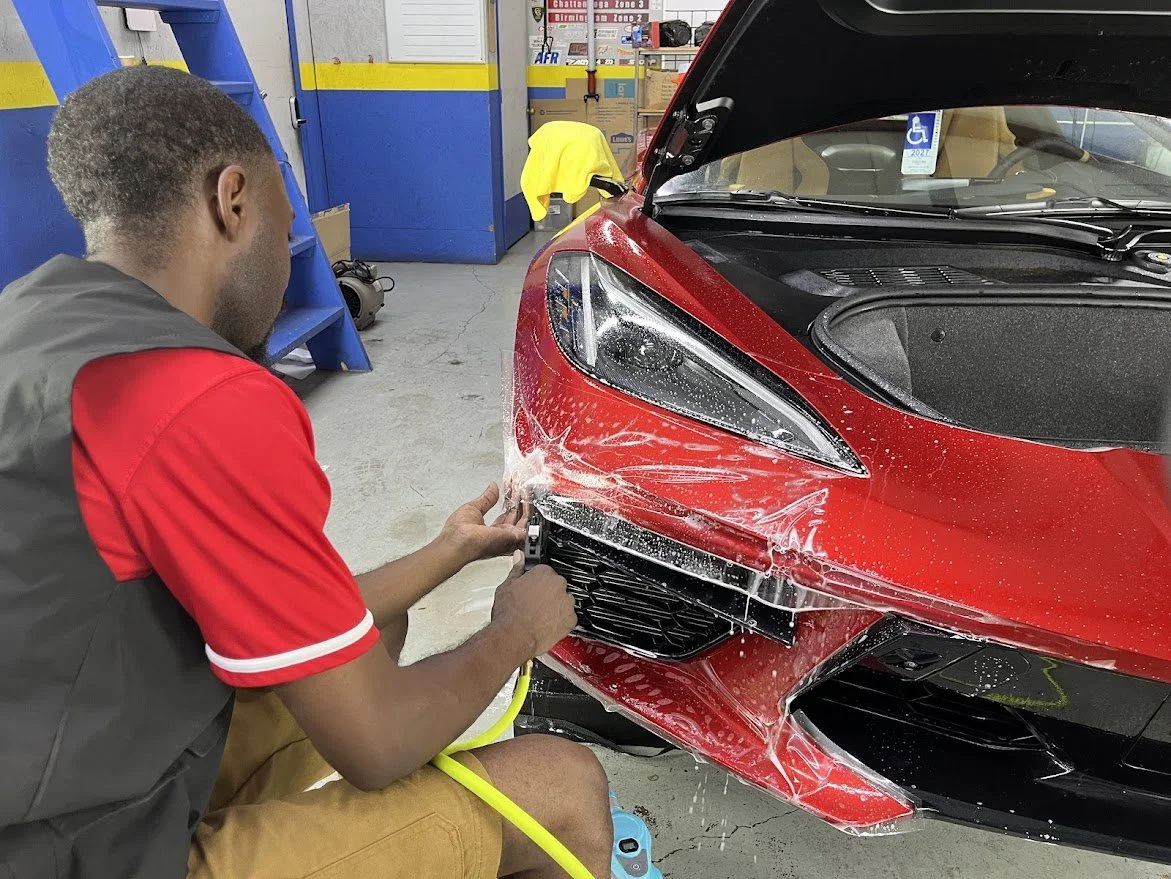 Front-line ready dealership vehicles after paint protection film installation for long-lasting finish.