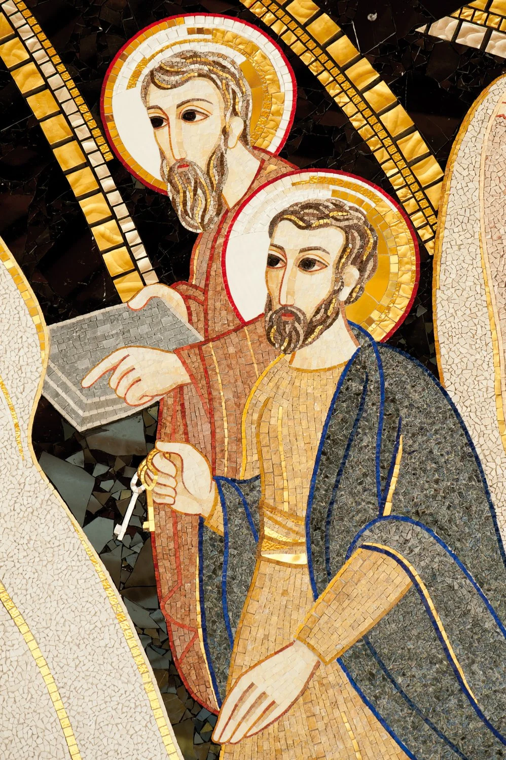 Mosaic of two religious figures with halos, one pointing to a scroll and the other holding a staff, against a detailed background.