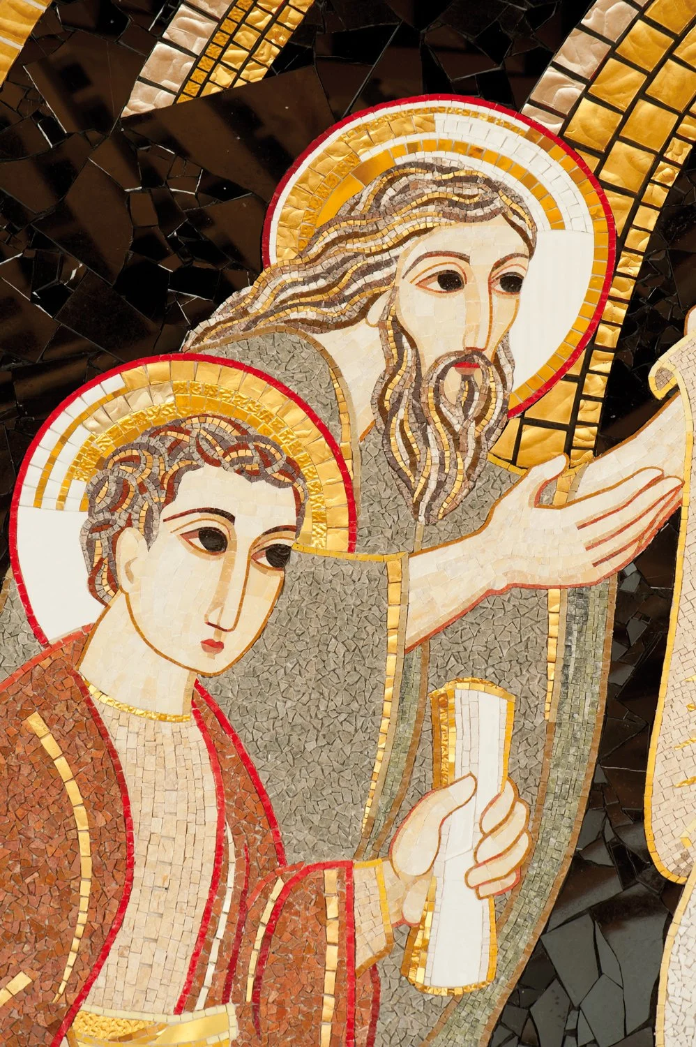 Mosaic of Jesus Christ and a woman, both with halos, depicted with detailed facial features and robes, against a geometric dark background.
