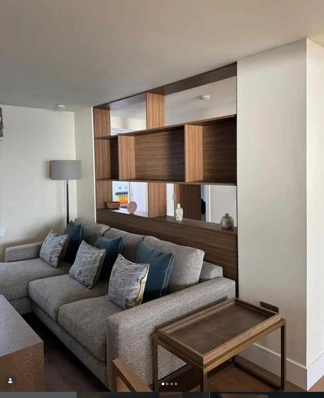 Custom designed dividing wall shelf unit.