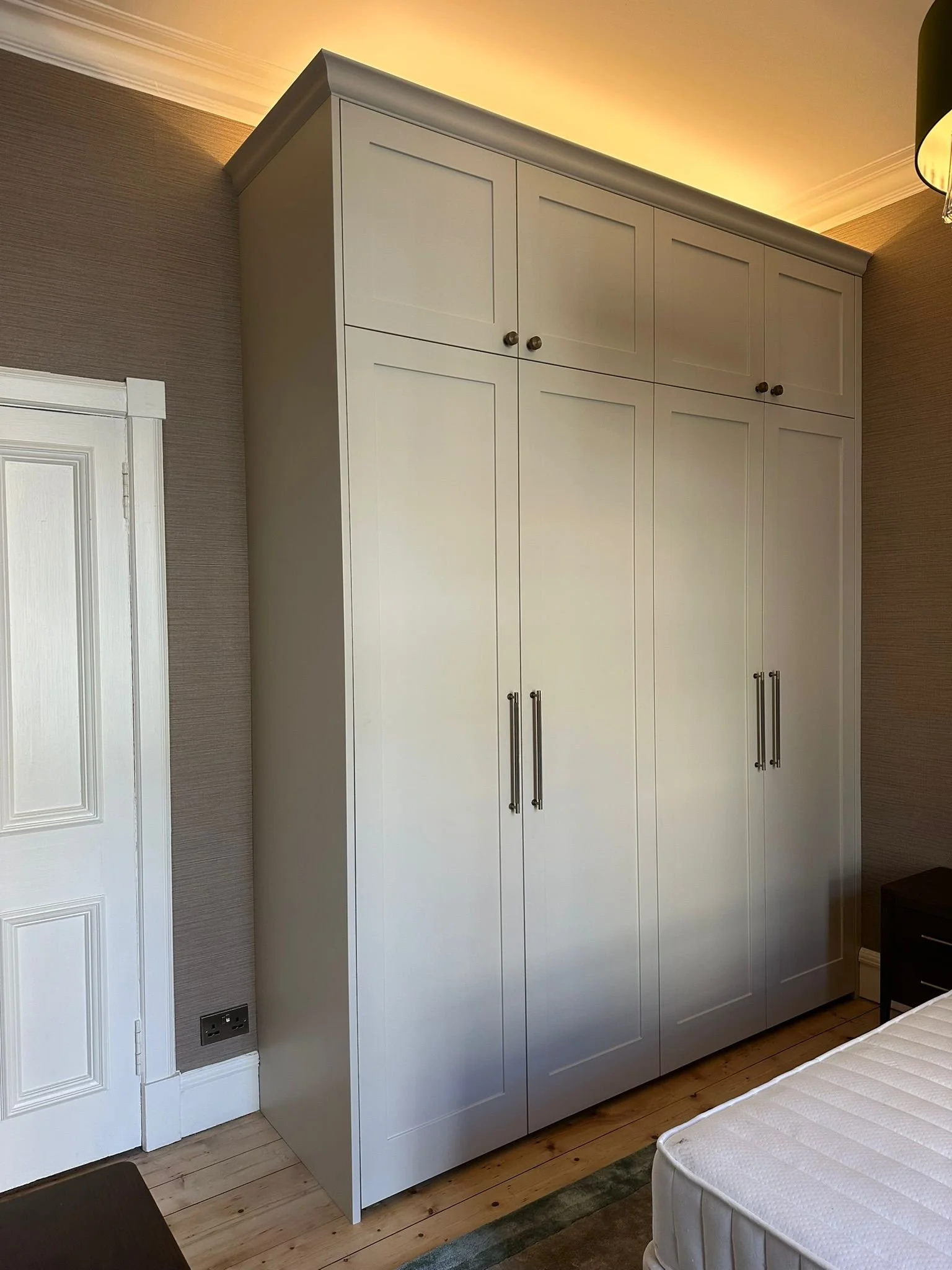Custom built and hand-sprayed fitted wardrobes.