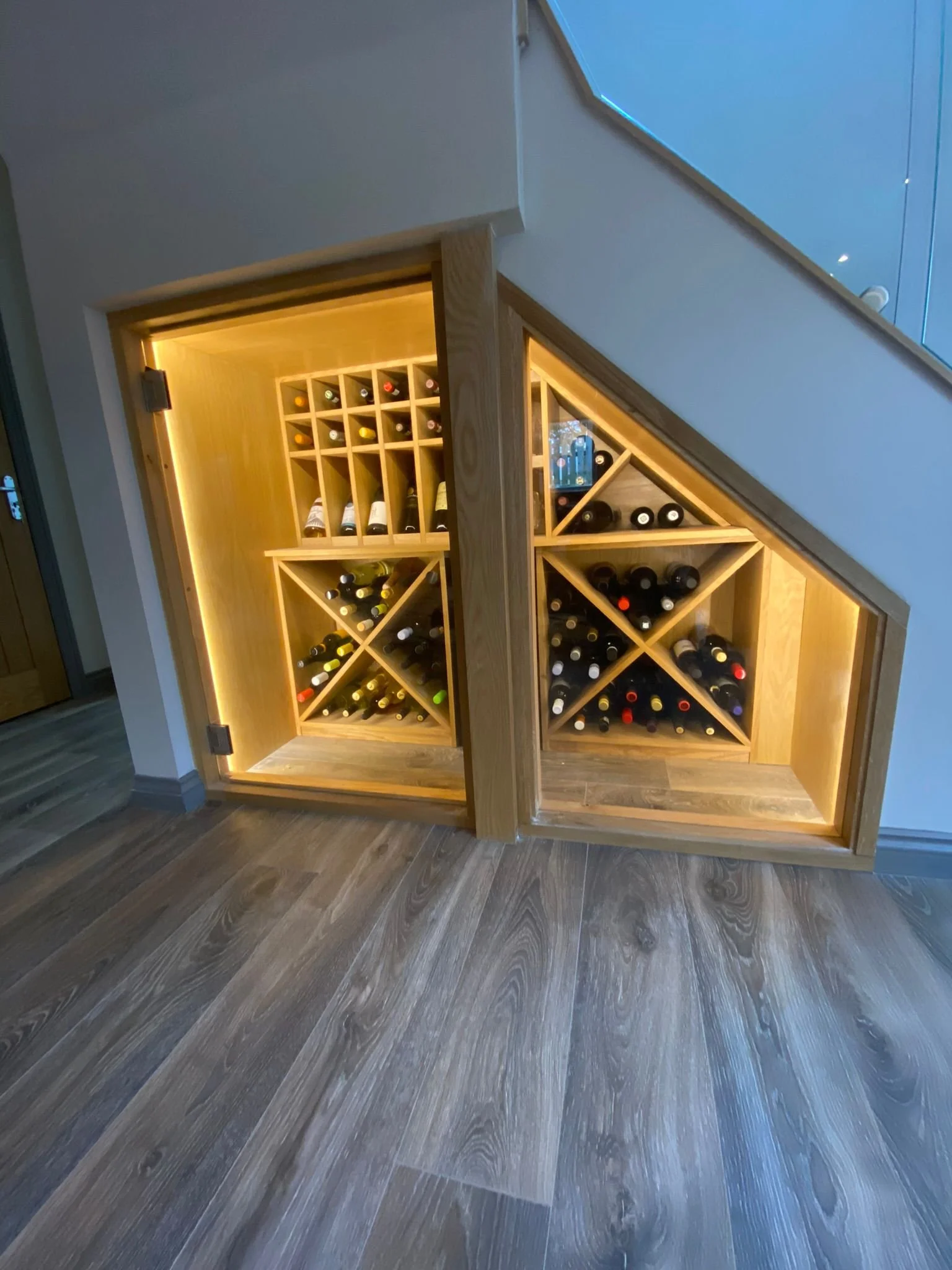 Under-stair wine store with feature LED lighting