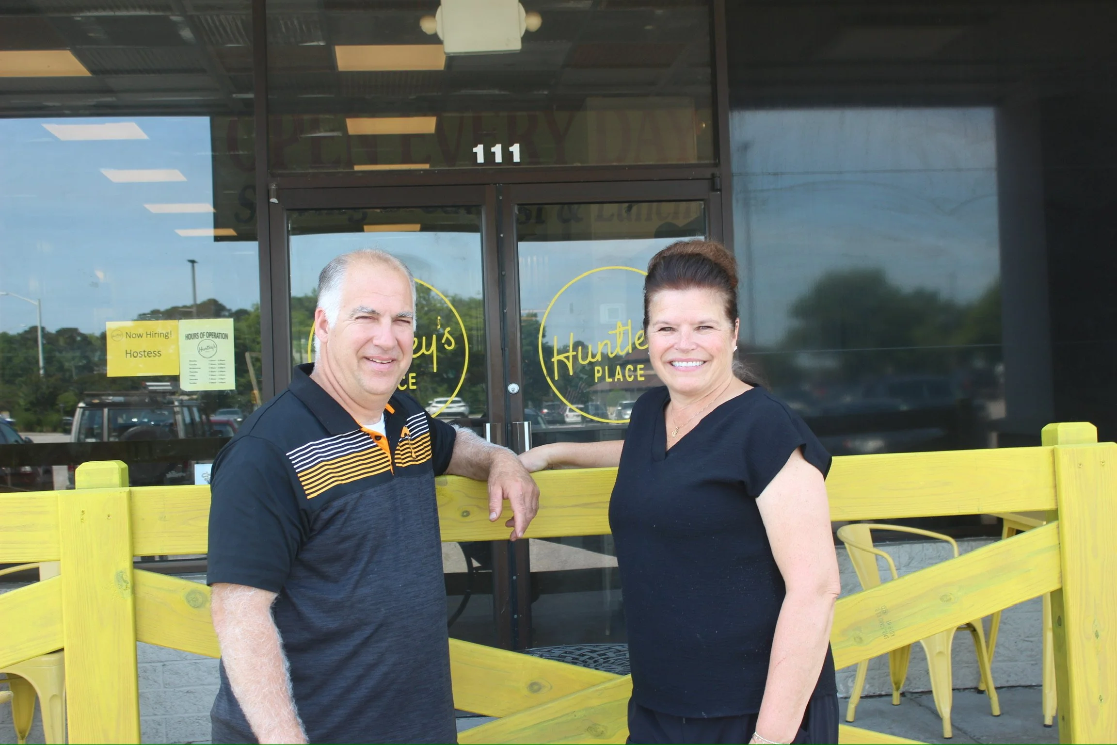 Smiling owners of Huntley's Place breakfast and brunch restaurant in Virginia Beach, near General Booth, Dam Neck Road, Ocean Lakes.