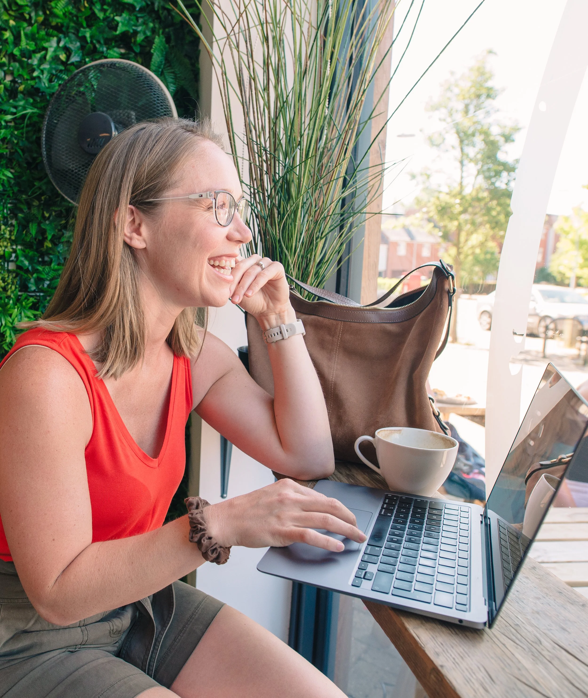 Sarah Keen working on her laptop at Coffee Hog in Colchester