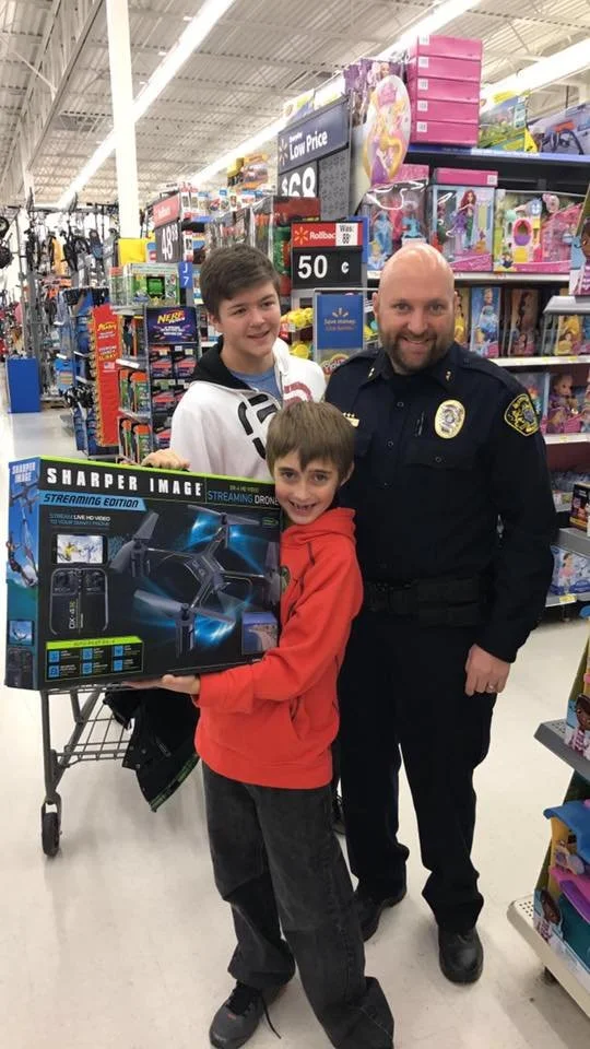 Aaron Shop with Cop.jpg