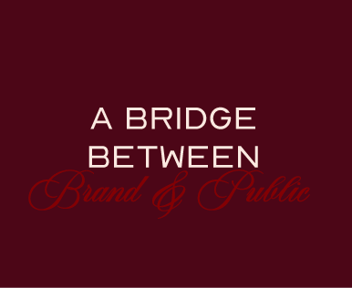 Text on a maroon background reading, "A BRIDGE BETWEEN Brand & Public," with "Brand & Public" in cursive red font.