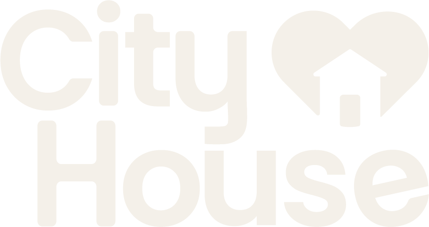 Graphic with the words "city" and "house" in large font, with a heart and house icon between them.