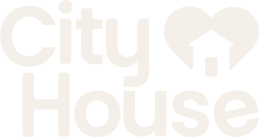 Graphic with the words "city" and "house" in large font, with a heart and house icon between them.