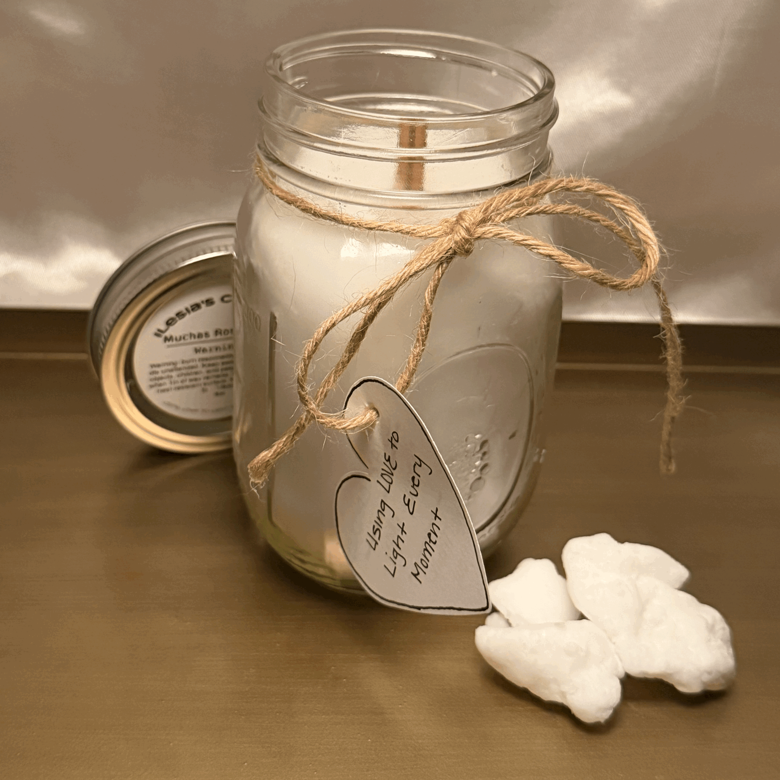 Artisan Mason Jar Candle | 12.5 oz
Hand-poured into a classic Mason jar, finished with a natural twine bow and sealed with a polished tin lid. Available in any fragrance from the Ilesia’s Candles collection at www.ilesiascandles.com.