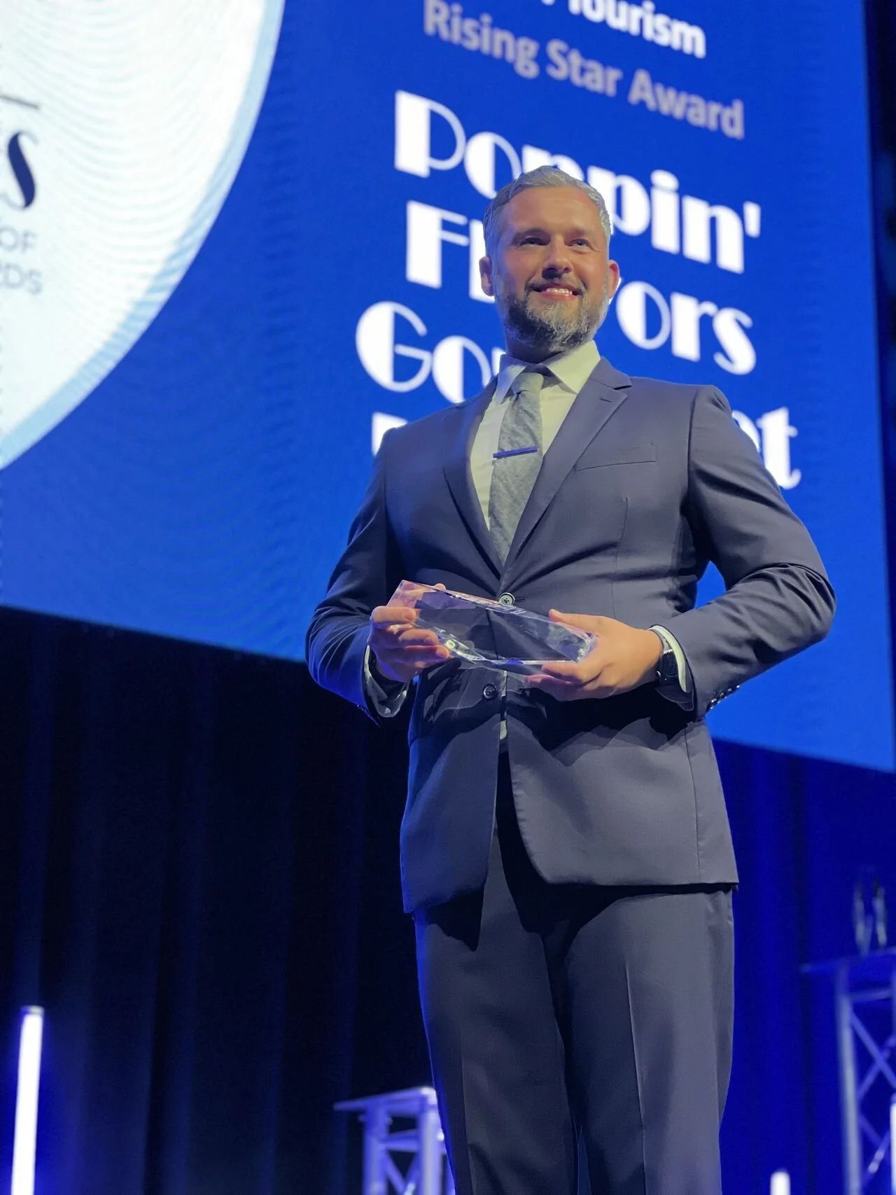 Seth Lieber receiving recognition at a tourism awards event