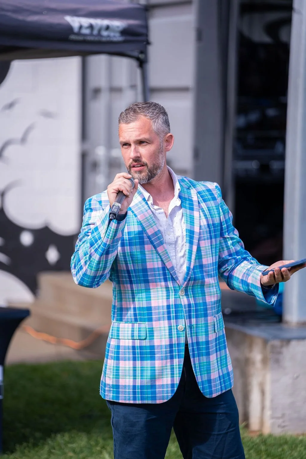 Seth Lieber hosting a live event with microphone