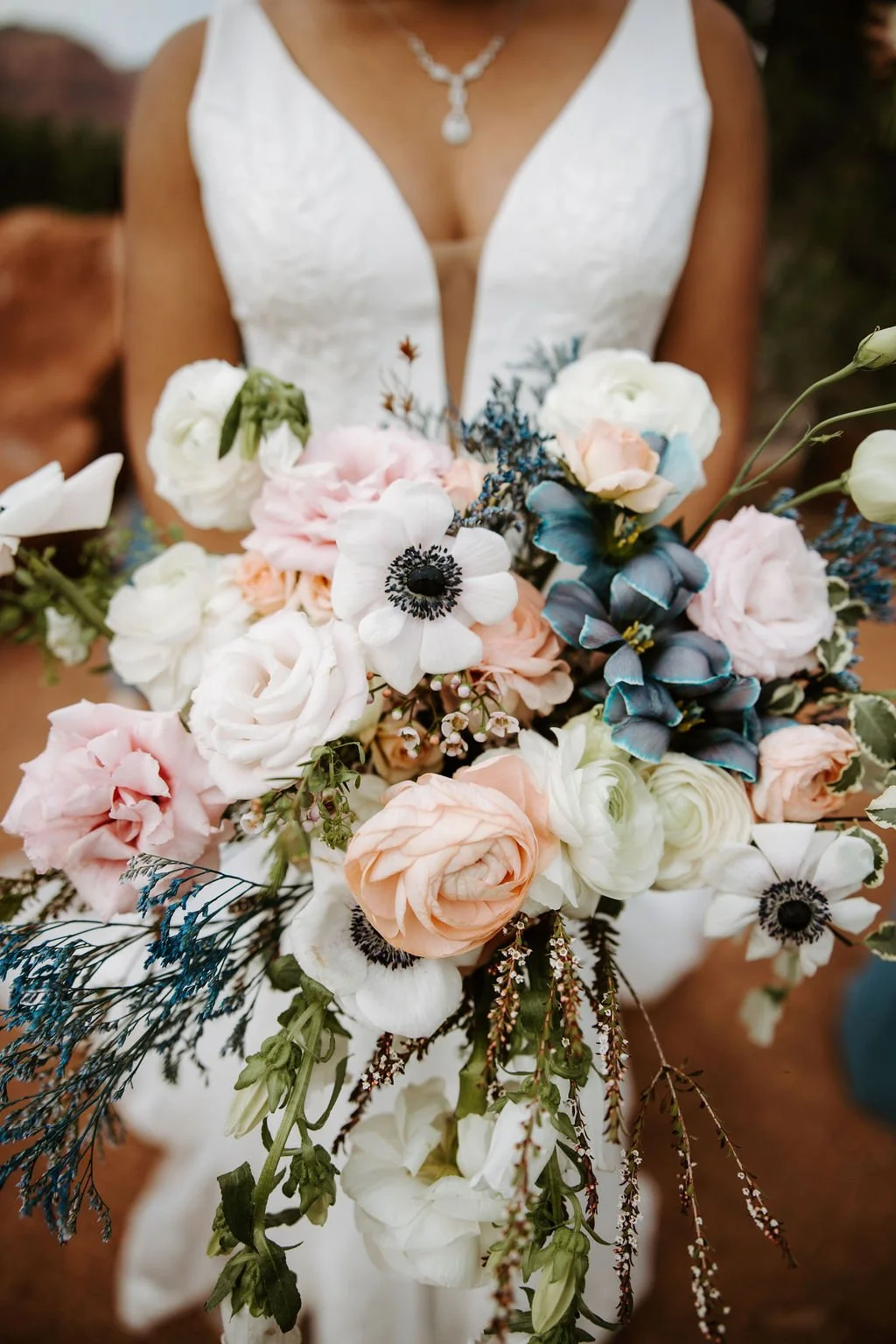 White, blush, peach with dusty blue accents bridal bouquet by white sage floral in sedona az.jpg