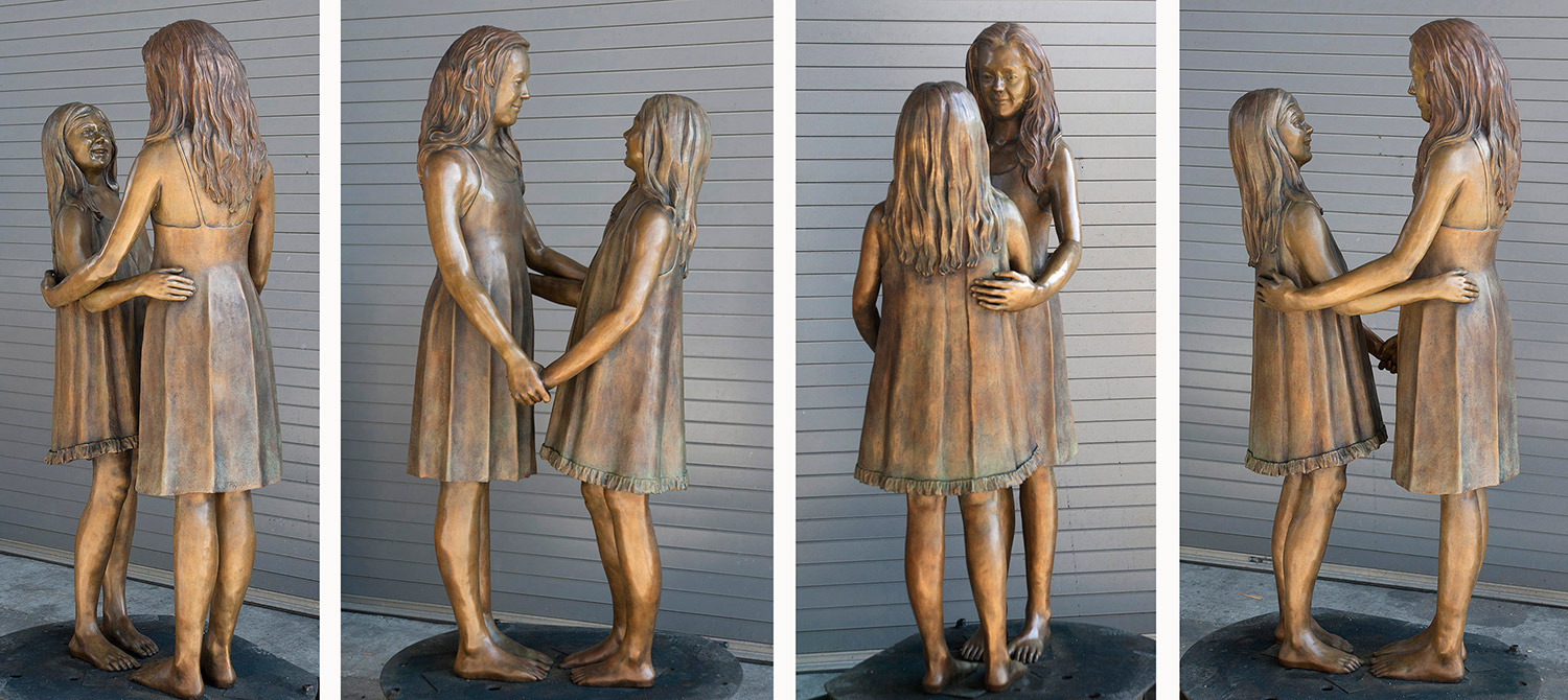 Four angles of Two Sisters bronze after receiving the final patina.