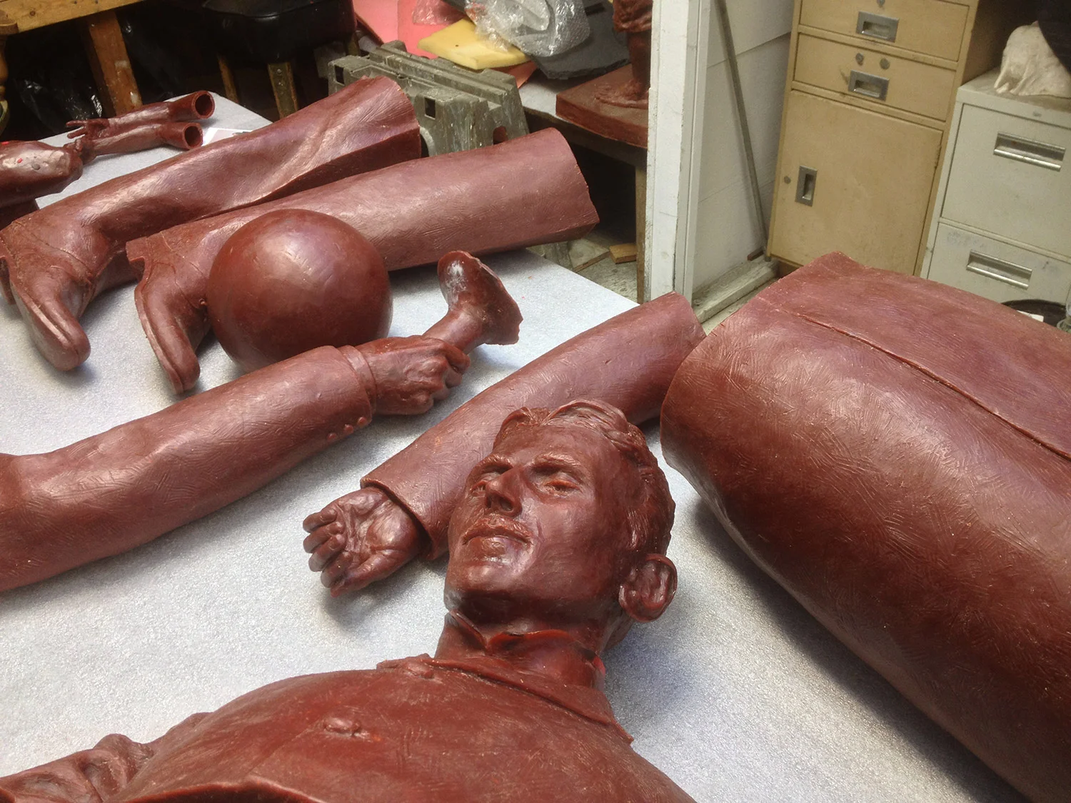 The seven foot clay sculpture first gets a silicon rubber mold which is reinforced with plaster. The next stage is a new wax original from the silicon mold. Here are the wax pieces prior to the ceramic shell mold. The wax will be burned out of the c…