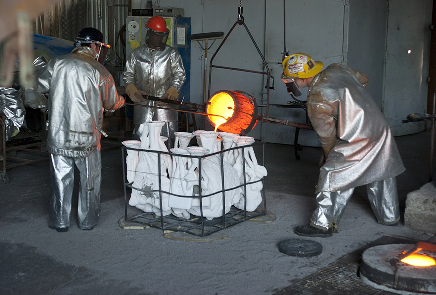 Molten bronze being poured into the a section of the full-sized Nikola Tesla statue ceramic shell.