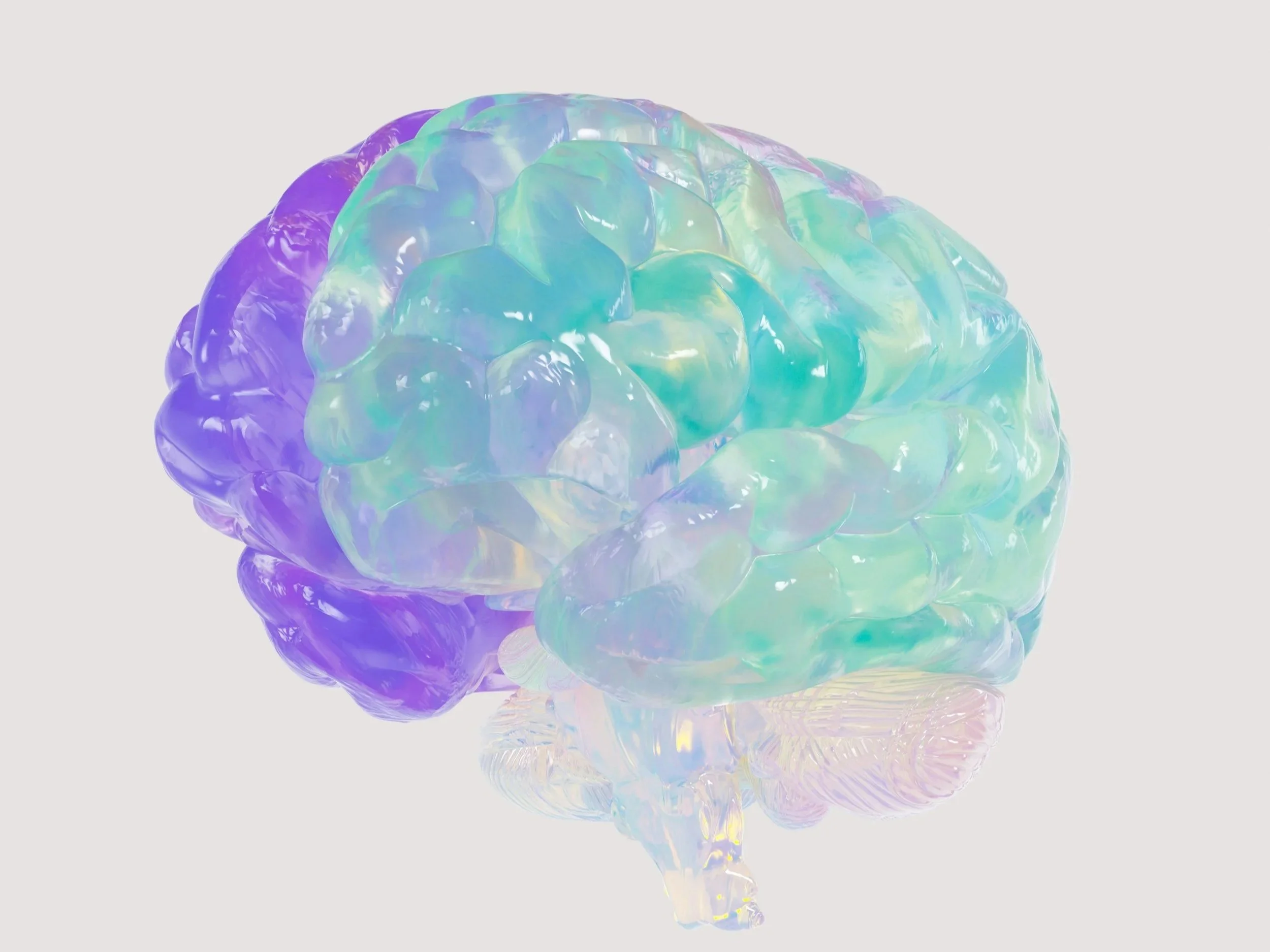 A colorful, iridescent brain sculpture with pastel hues of purple, green, and blue on a white background.