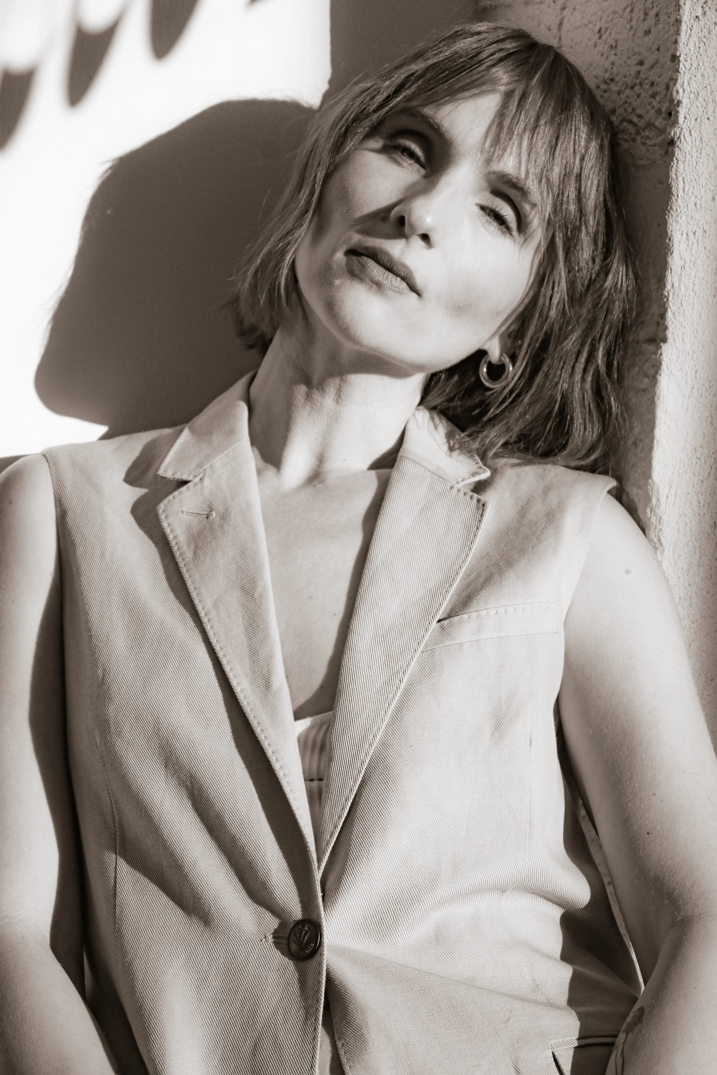 Natasha Yaroshenko, Human Design coach, looking upward in natural light