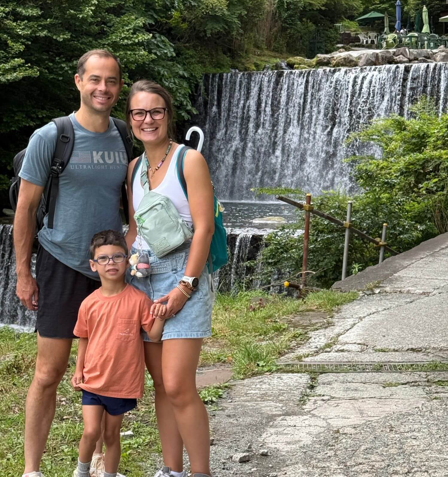 Our family in front of the waterfall at the trout fishing spot in Hakone
