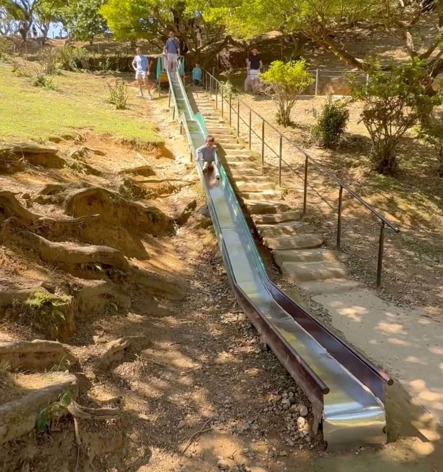 Jackson on the playground slide at Arashiyama Monkey Park