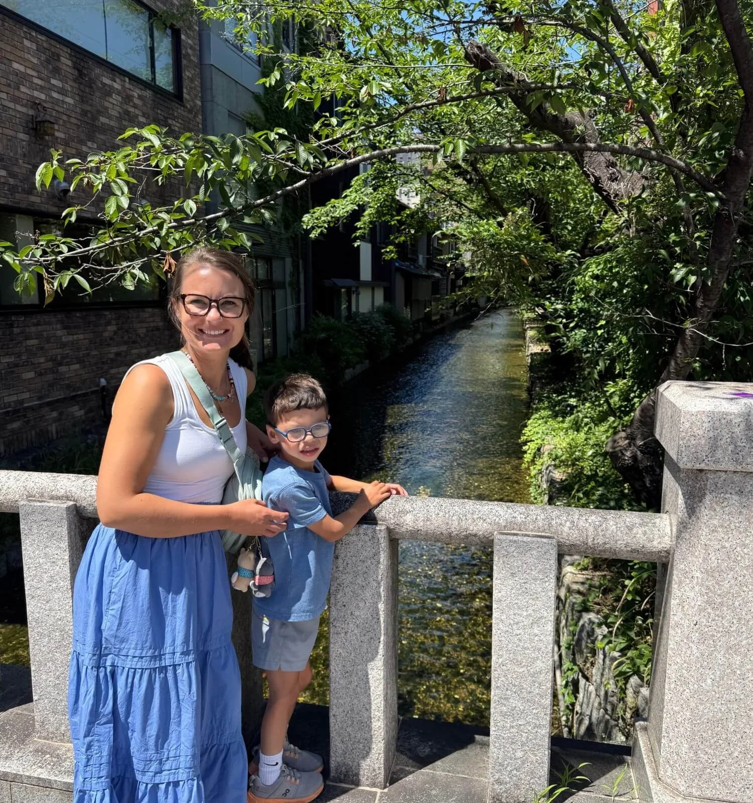 A quiet Kyoto street, with a creek running beneath the road behind us