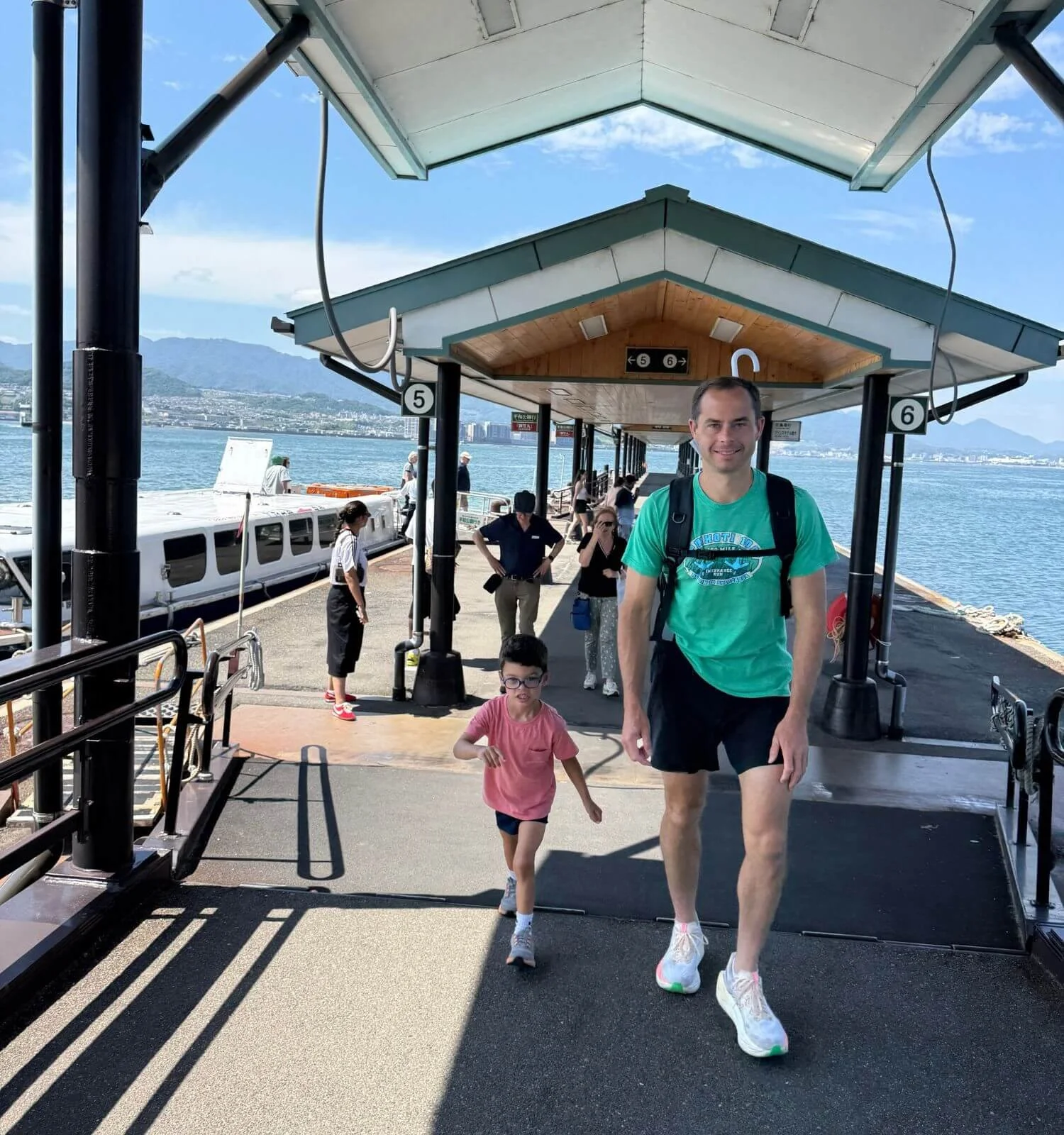 Matt and Jackson stepping off the World Heritage Sea Route ferry on Miyajima