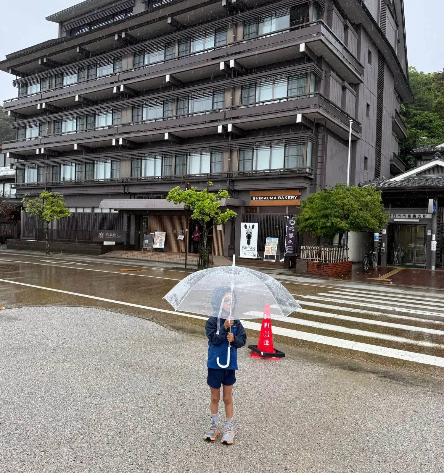 Jackson with his umbrella outside Hotel Miyajima Villa