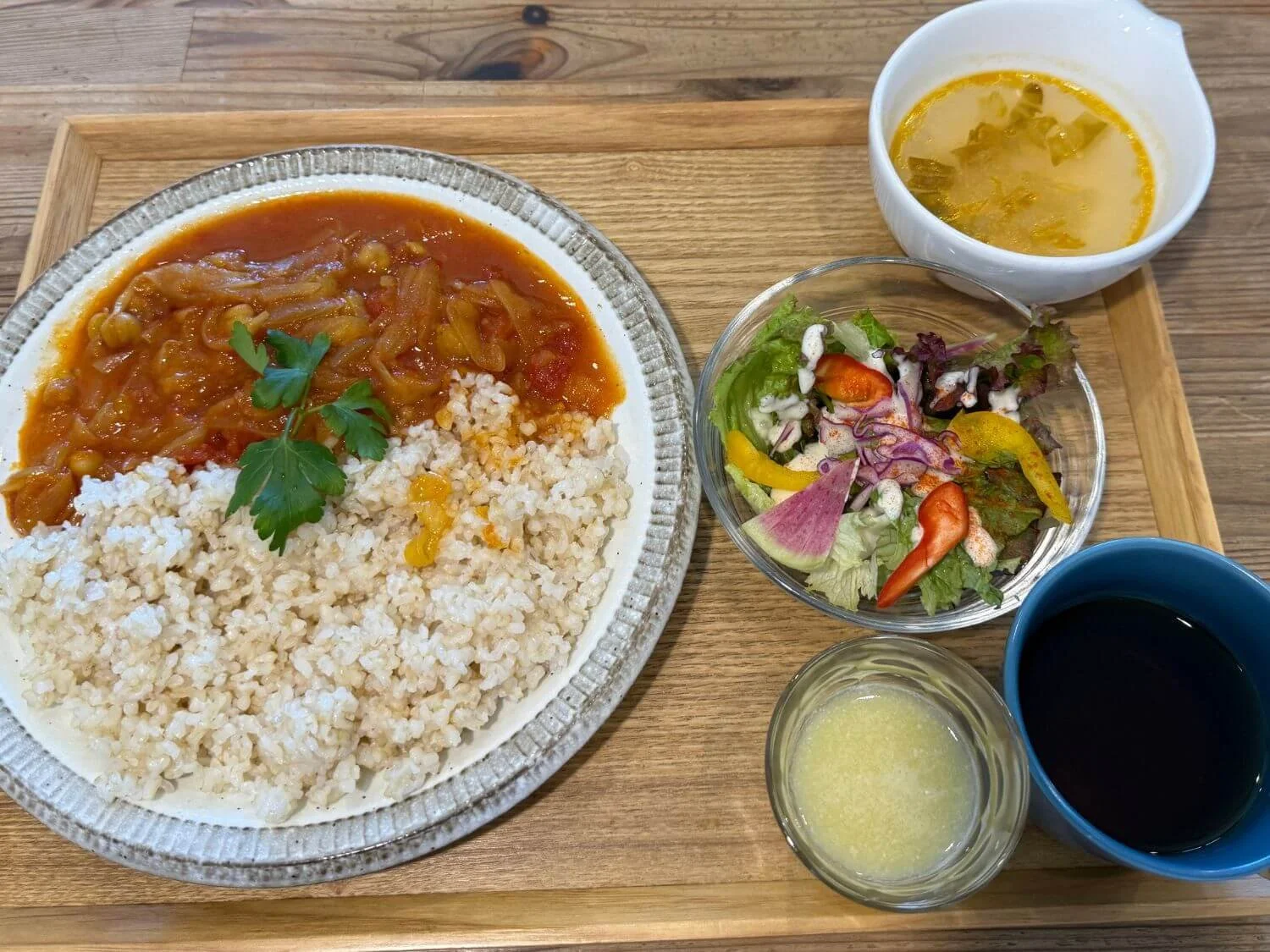 Vegan curry lunch set with salad and miso soup at Musubi Cafe in Kyoto, Japan
