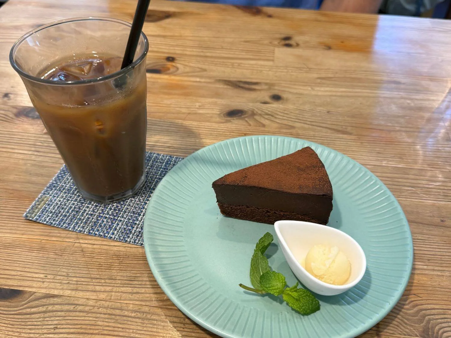 Gluten-free chocolate ganache cake and iced coffee at Musubi Cafe in Kyoto, Japan.
