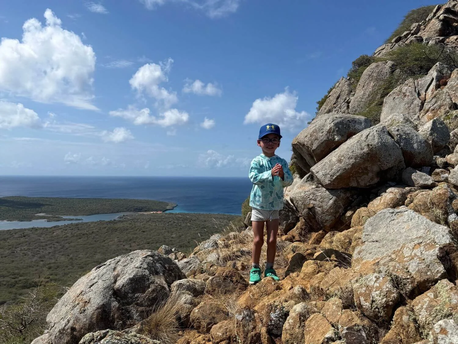 Family hiking the rocky trail near the top of Mt. Brandaris in Bonaire.