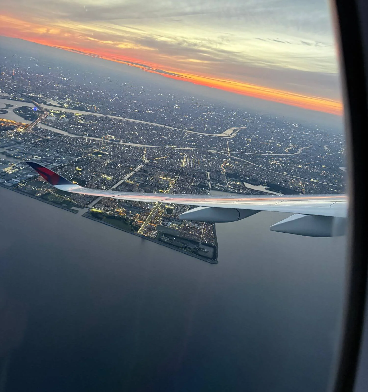 View of the Tokyo skyline from an airplane window while approaching the city, Japan