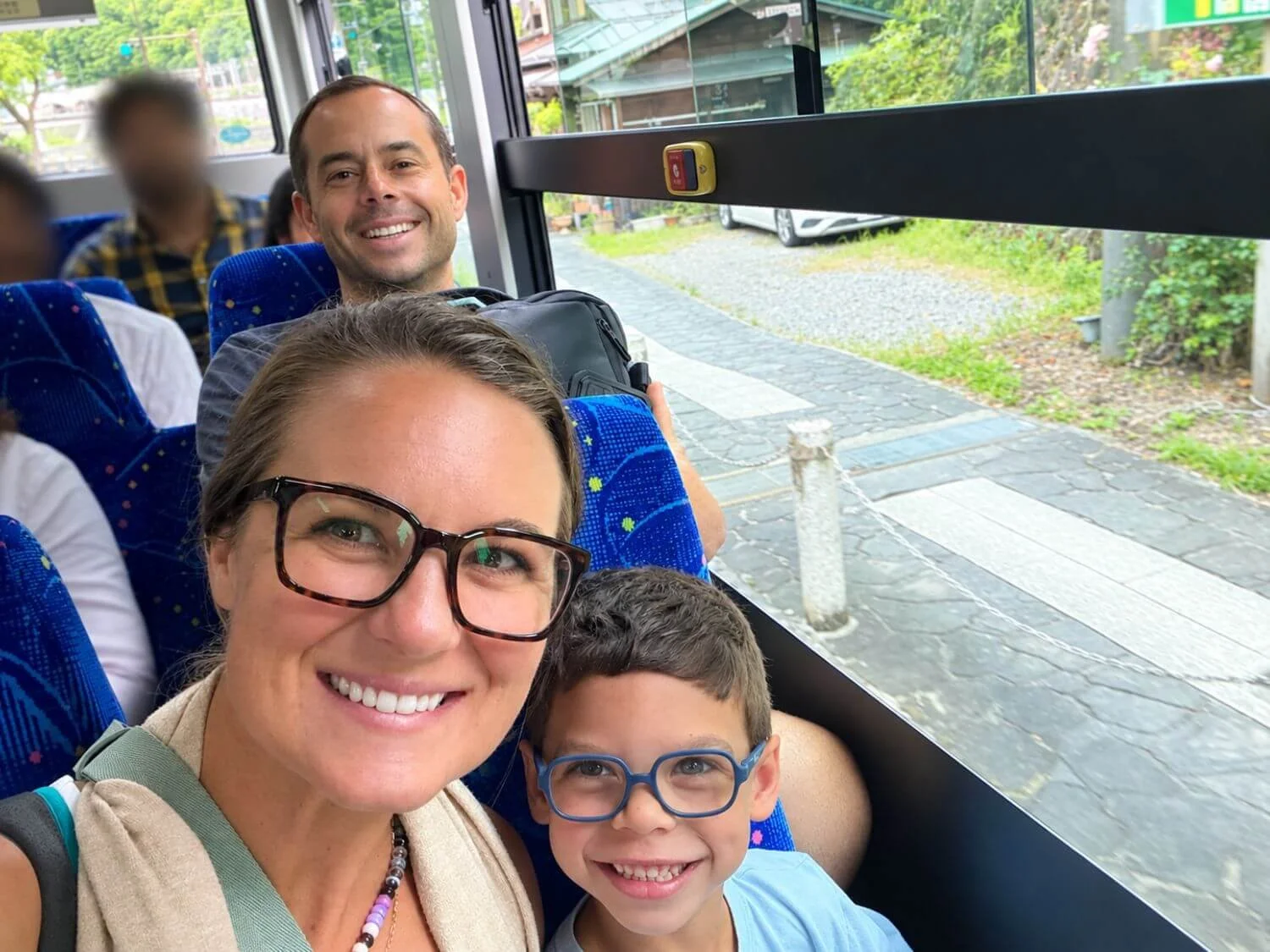 Family aboard a bus in Japan.