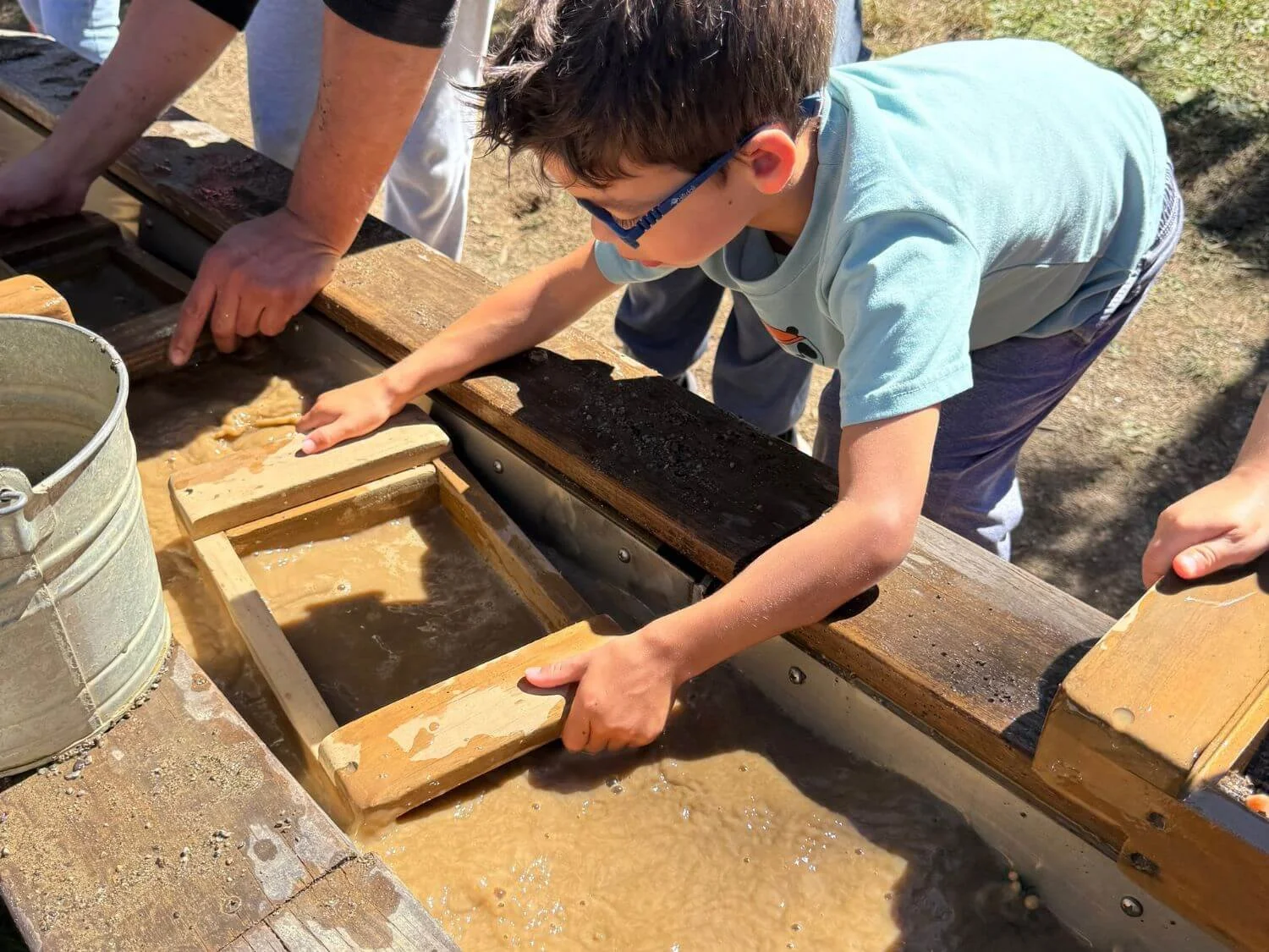 Boy gem mining at Sky Top Orchard in Flat Rock, North Carolina.