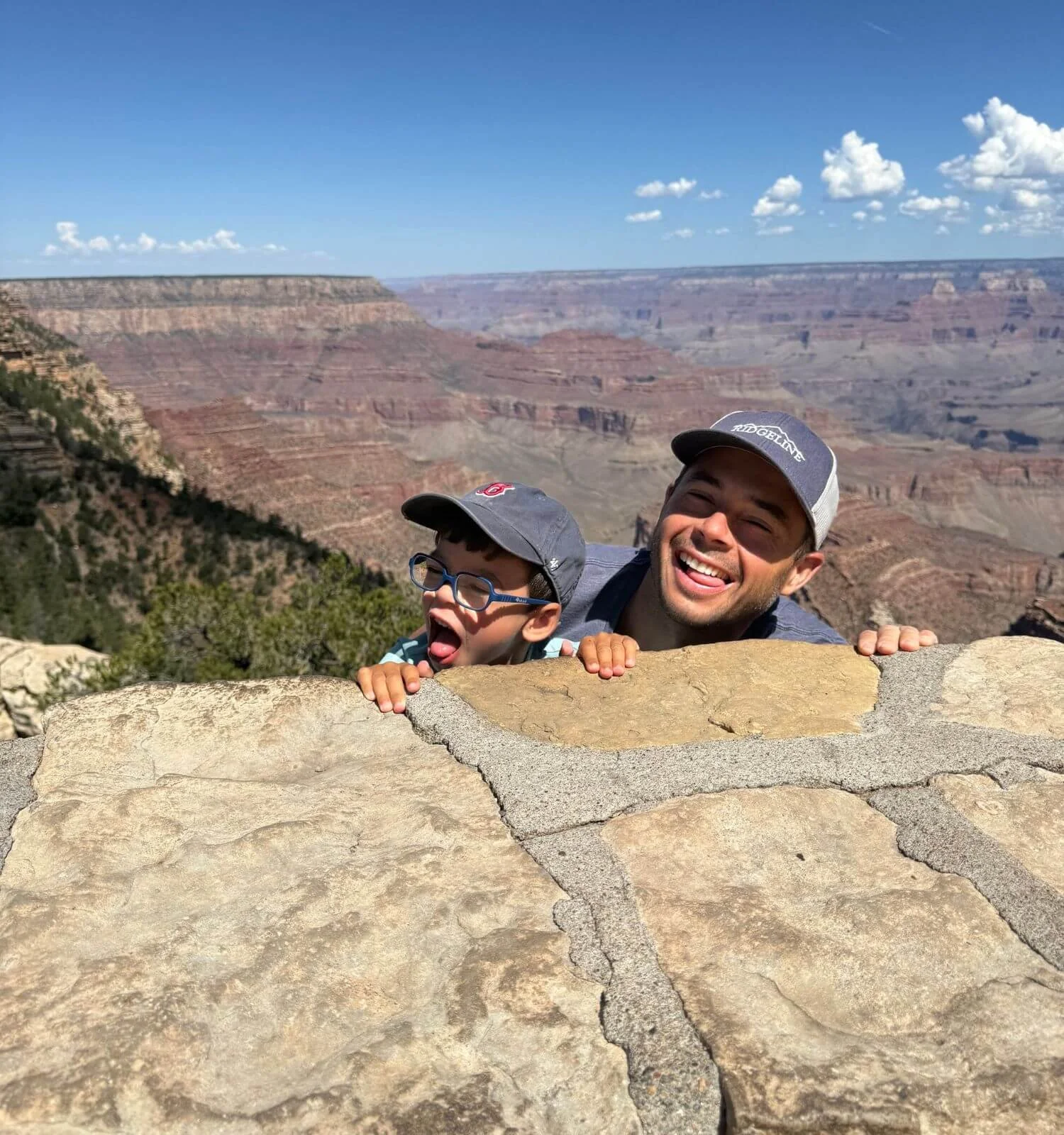 Father and son being silly at grand canyon national park in Arizona USA
