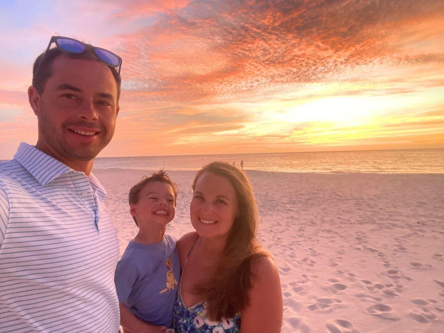 Family photo during sunset on the beach in Aruba.