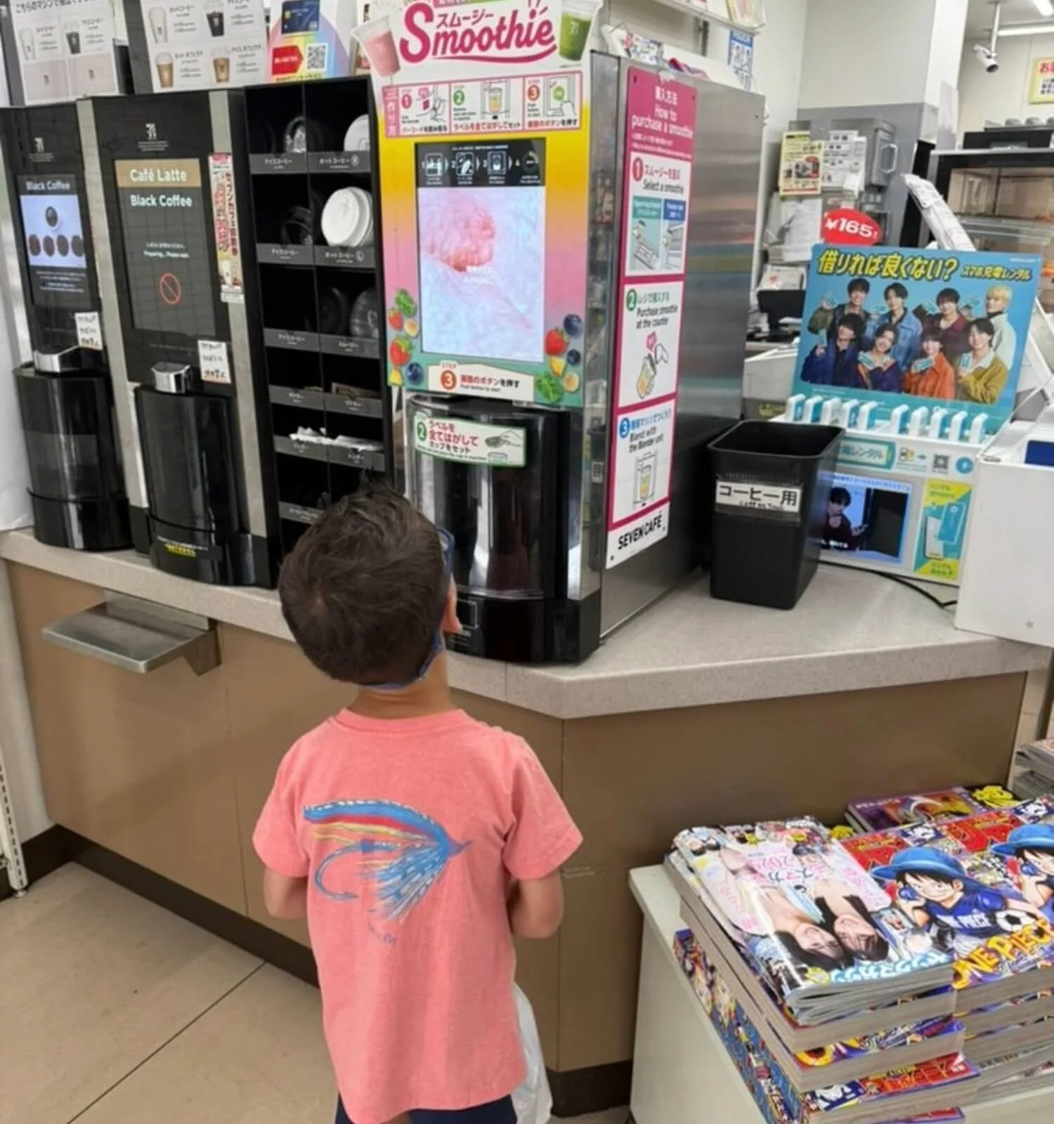 Boy waiting on his smoothie at a convenience store in Japan.