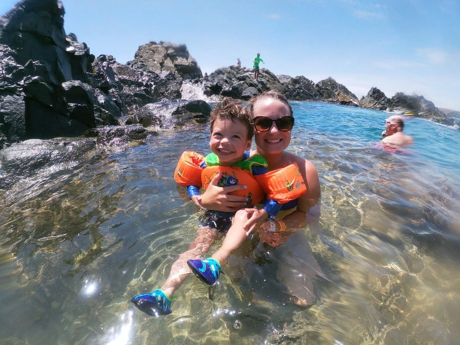 Mom and toddler at the Natural Pool in Aruba.