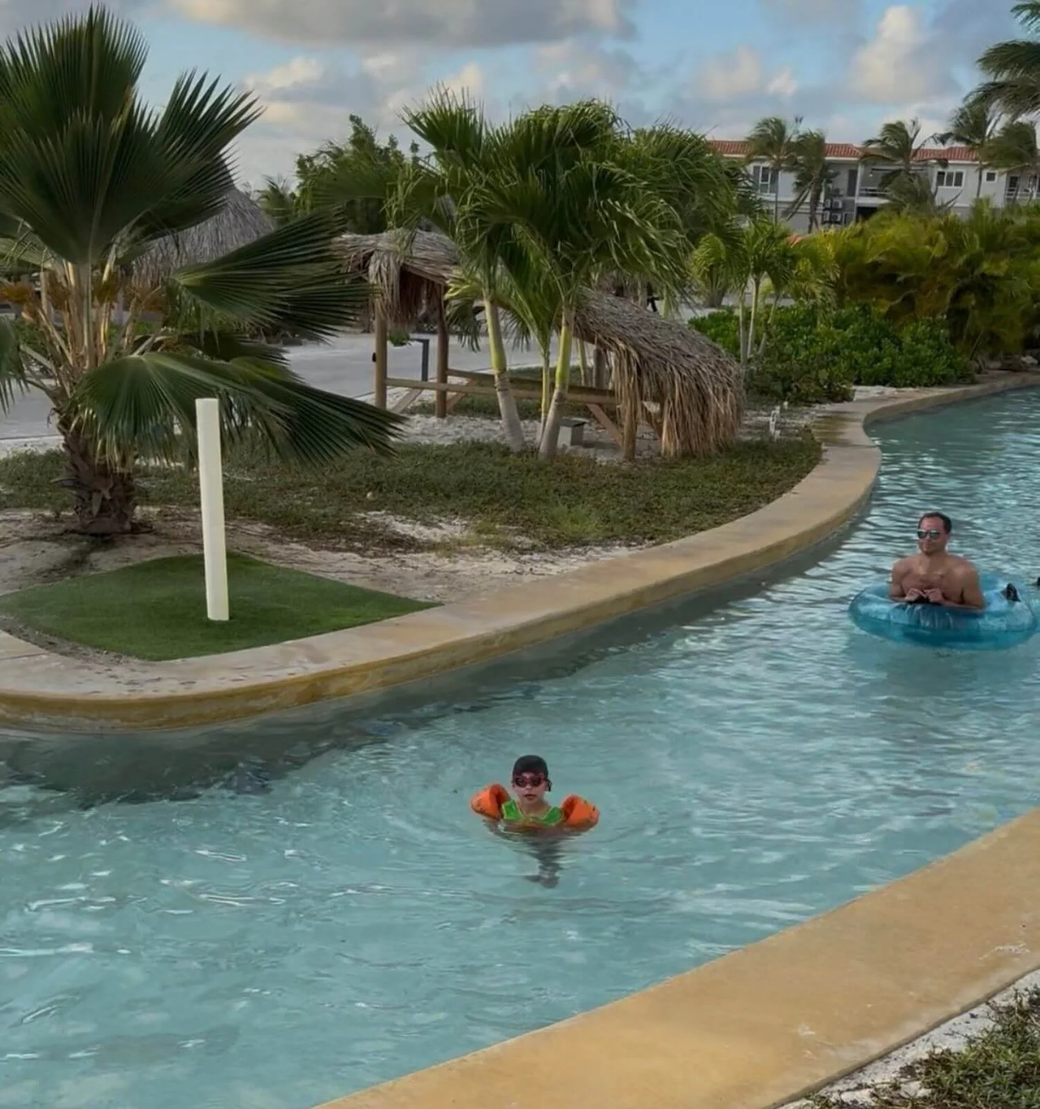 Dad and son in the lazy river at Chogogo resort in Bonaire.