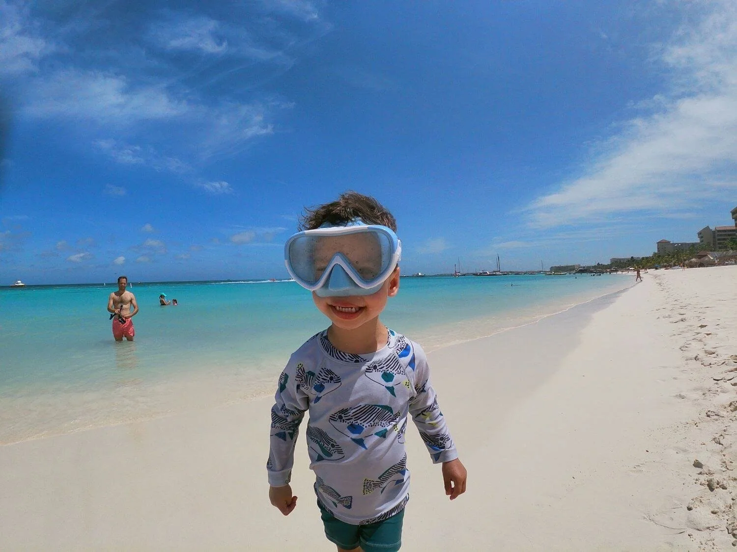 Boy wearing goggles on Palm Beach Aruba.