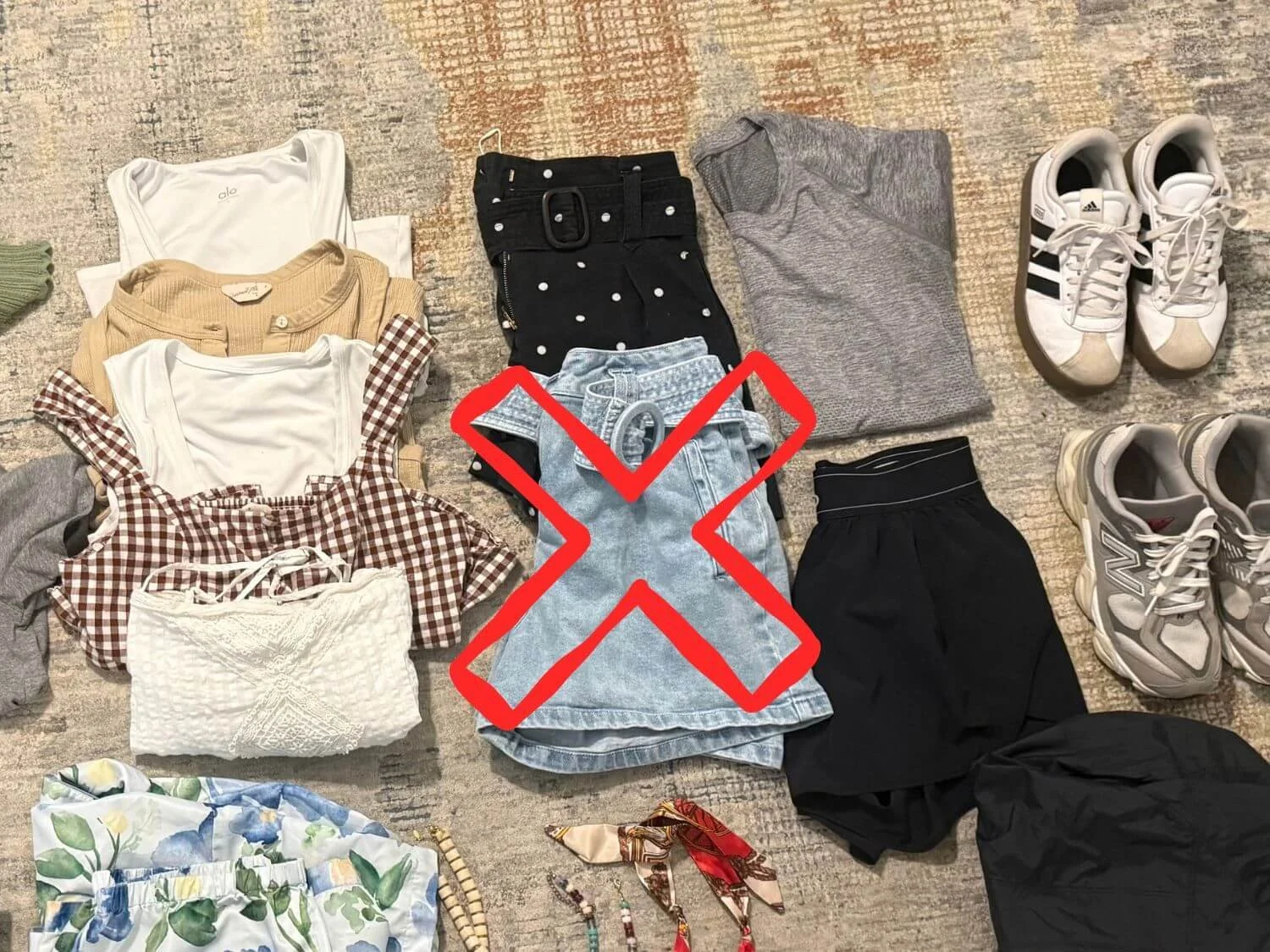 Jean shorts with an X over them to indicate they are not a good choice to pack for a Japan trip.
