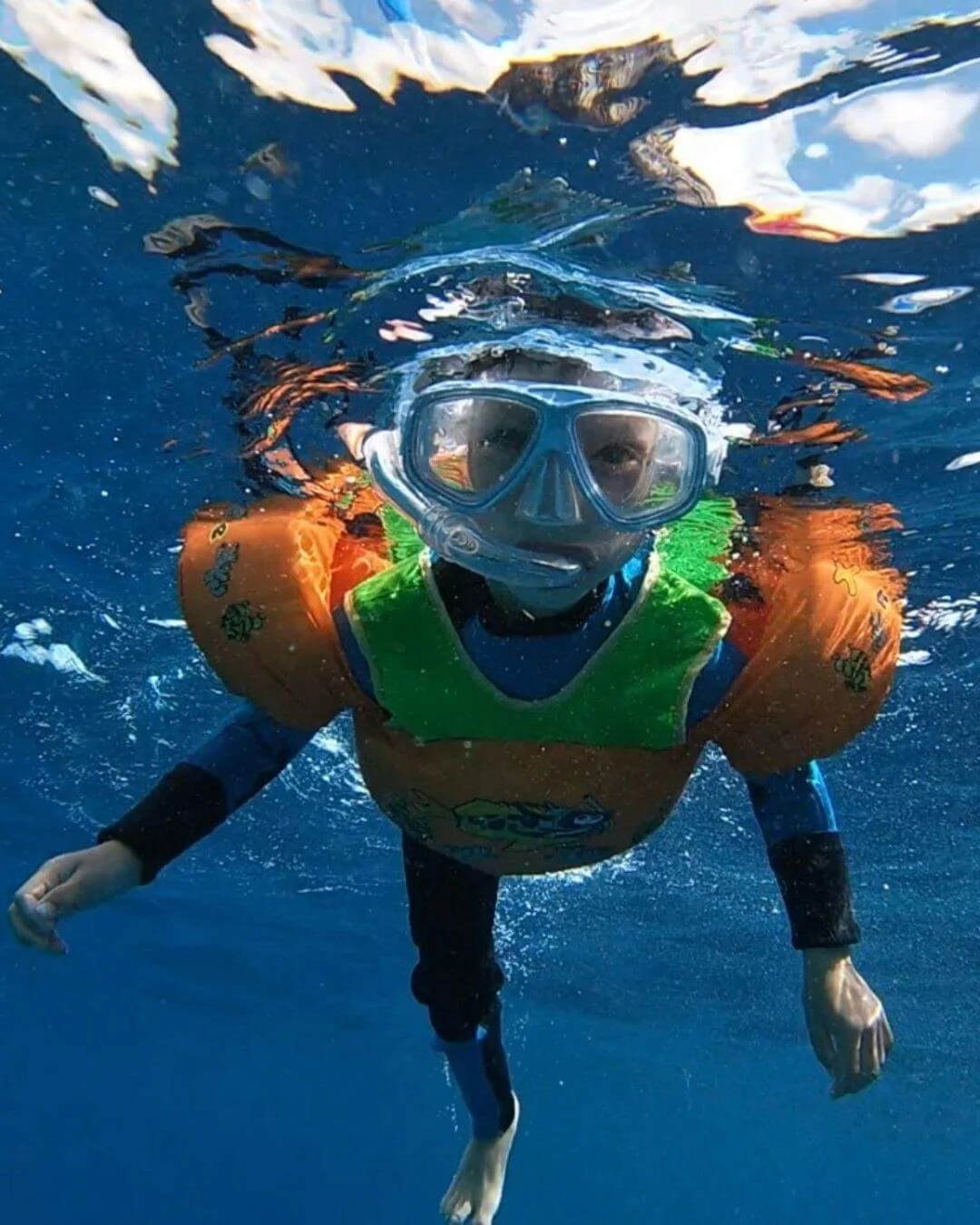 Family snorkeling underwater - follow us on Instagram and Pinterest