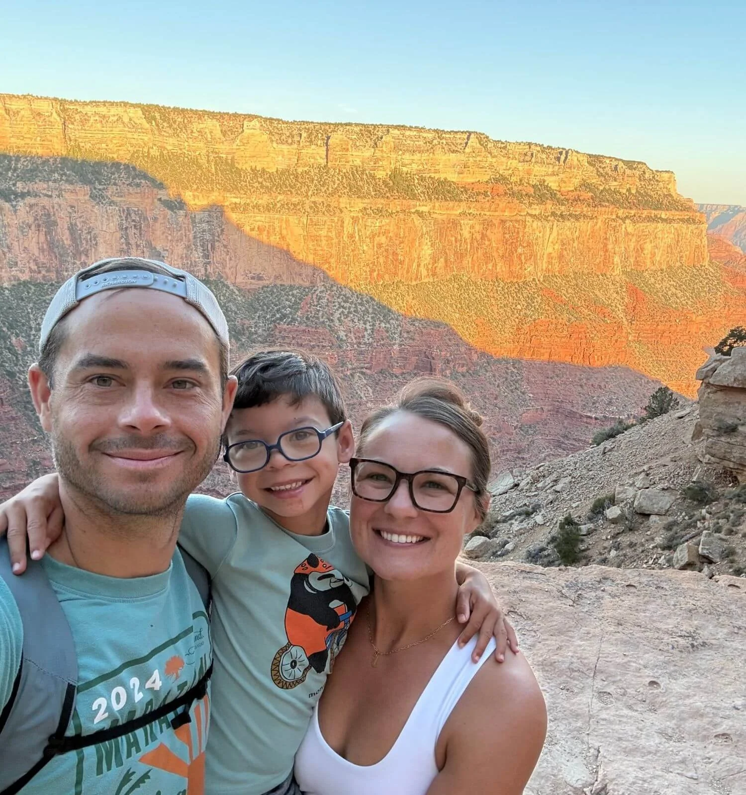 Family selfie at Ooh Aah Point at sunrise on South Kaibab Trail in the Grand Canyon National Park in Arizona, USA