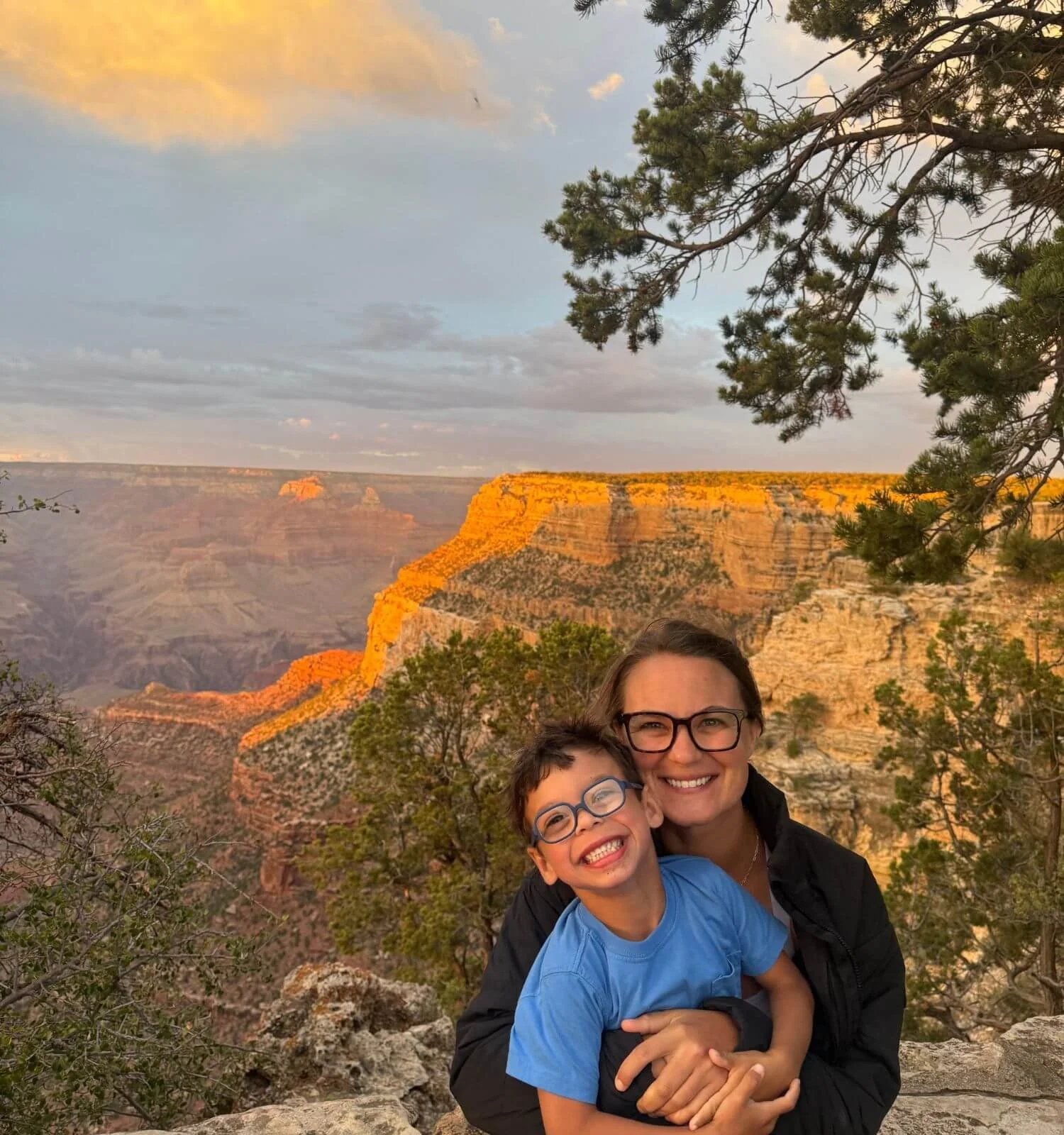 Mother and son at sunset at bright angel trailhead overlook in the Grand Canyon National Park