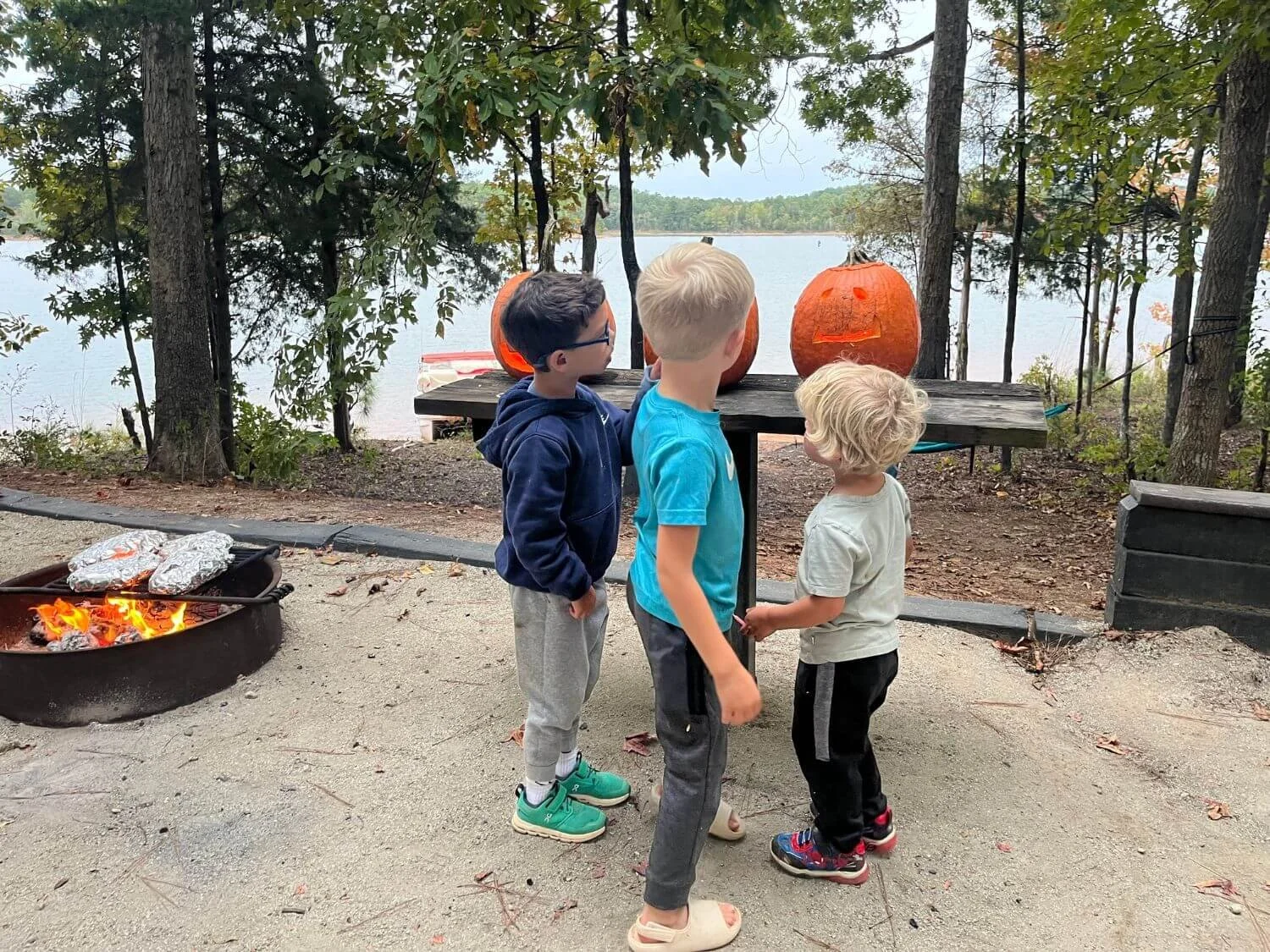 Boys carving pumpkins at Calhoun Falls State Park.