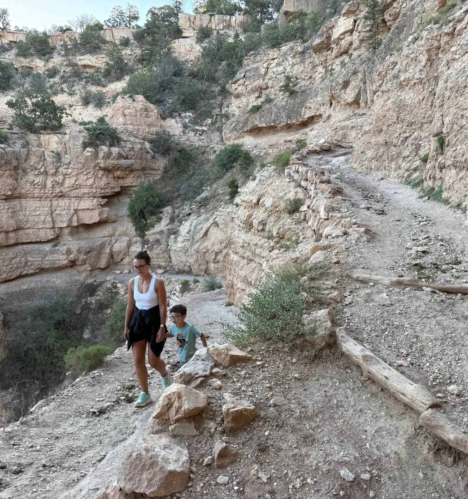 Mother and son hiking the South Kaibab trail to Ooh Aah point at sunrise in the Grand Canyon National Park in Arizona, USA