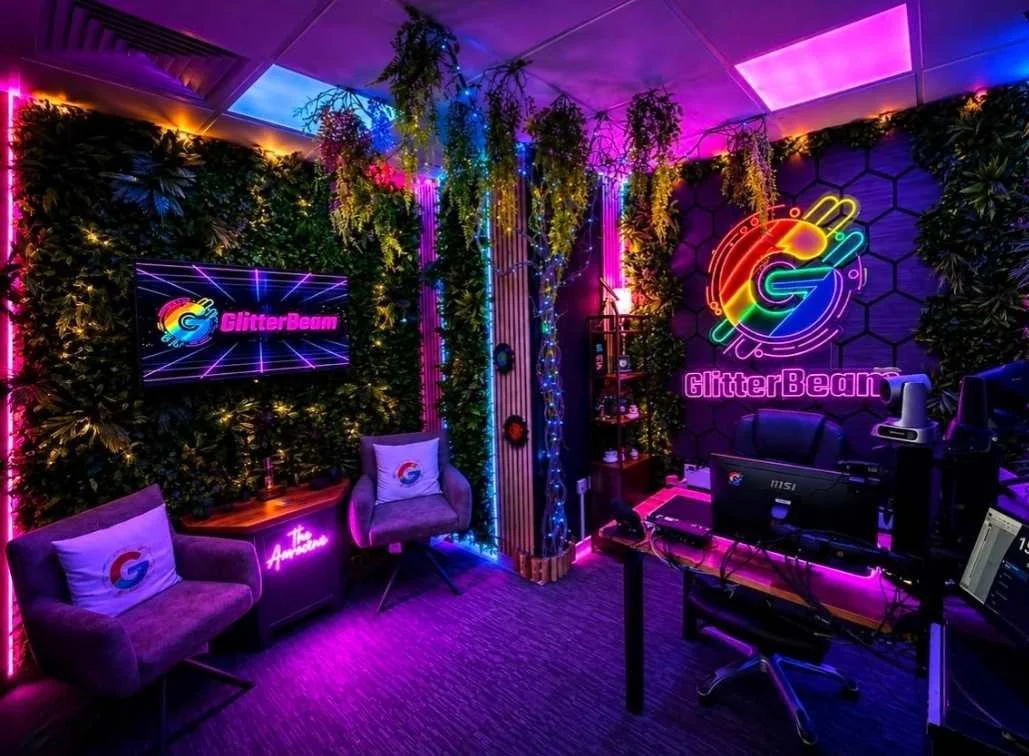 GlitterBeam Radio studio with the colourful GlitterBeam branding and broadcasting equipment.
